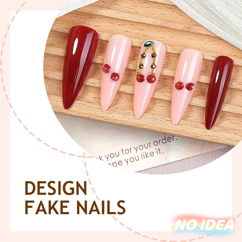 Wine red almond shaped press on nails with bright red cherry prints.