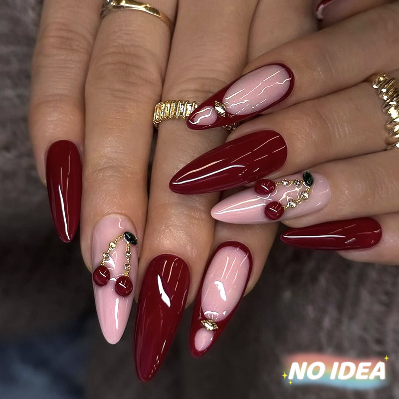 Wine red almond shaped press on nails with bright red cherry prints.