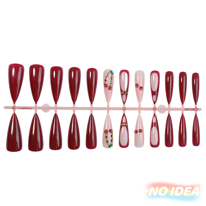 Wine red almond shaped press on nails with bright red cherry prints.