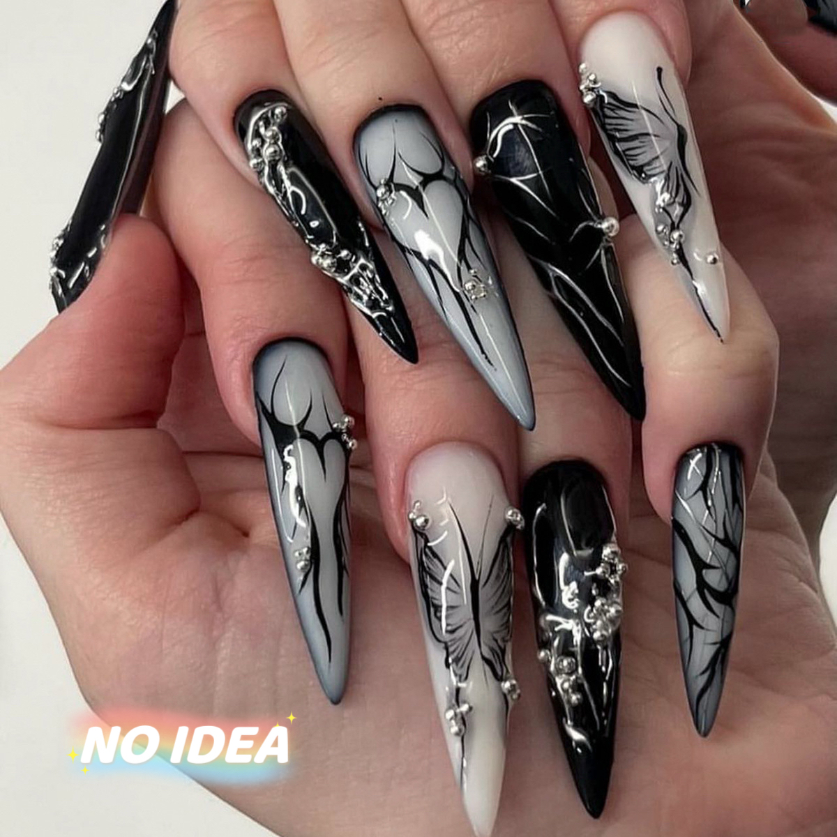 Long almond shaped press on nails in a dark, edgy gothic-punk style, shown in multiple sizes.