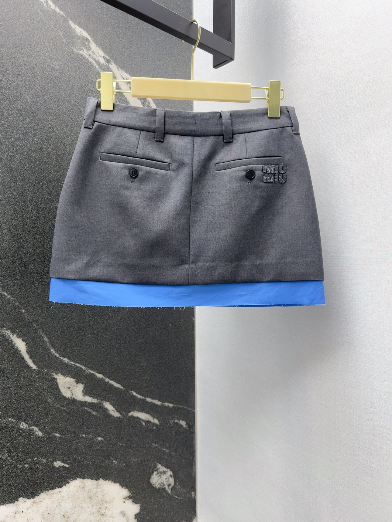 MIU suit with blue trimmed skirt