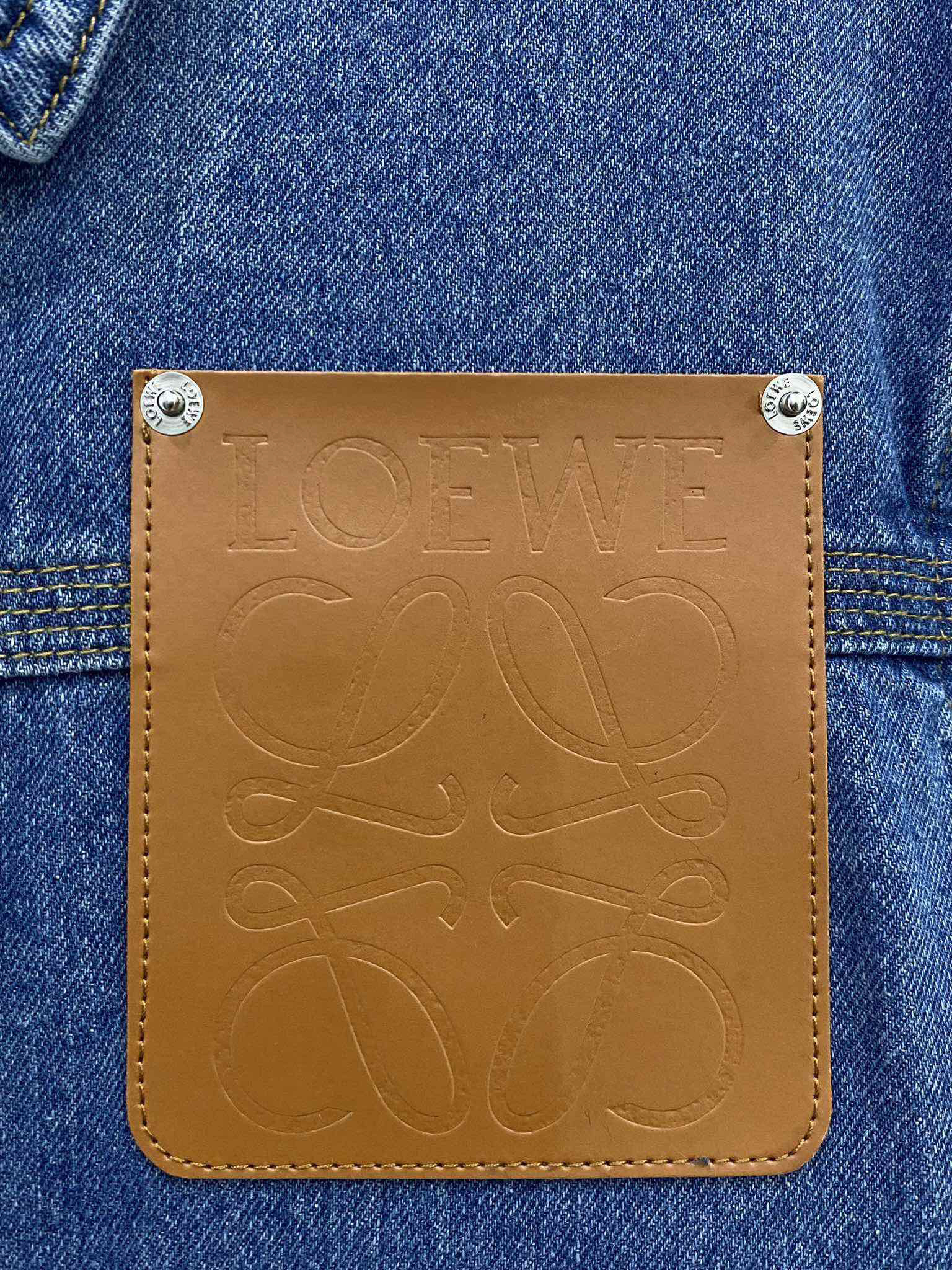 LOE25SS leather embossed logo denim jacket