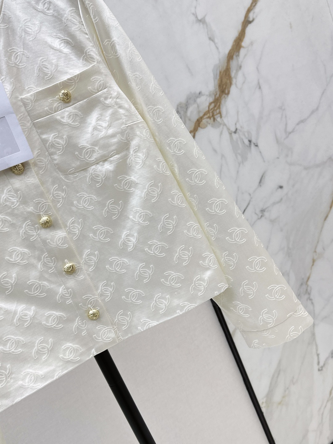 CC 25SS White embossed jacket with dark patterns