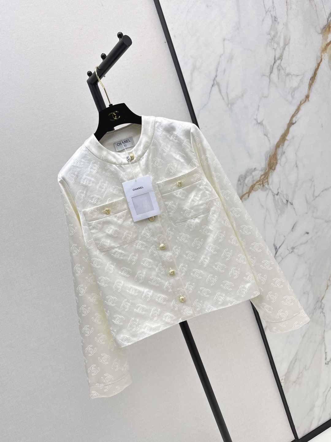 CC 25SS White embossed jacket with dark patterns