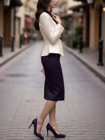 Two-piece suit with cream blazer and dark blue skirt