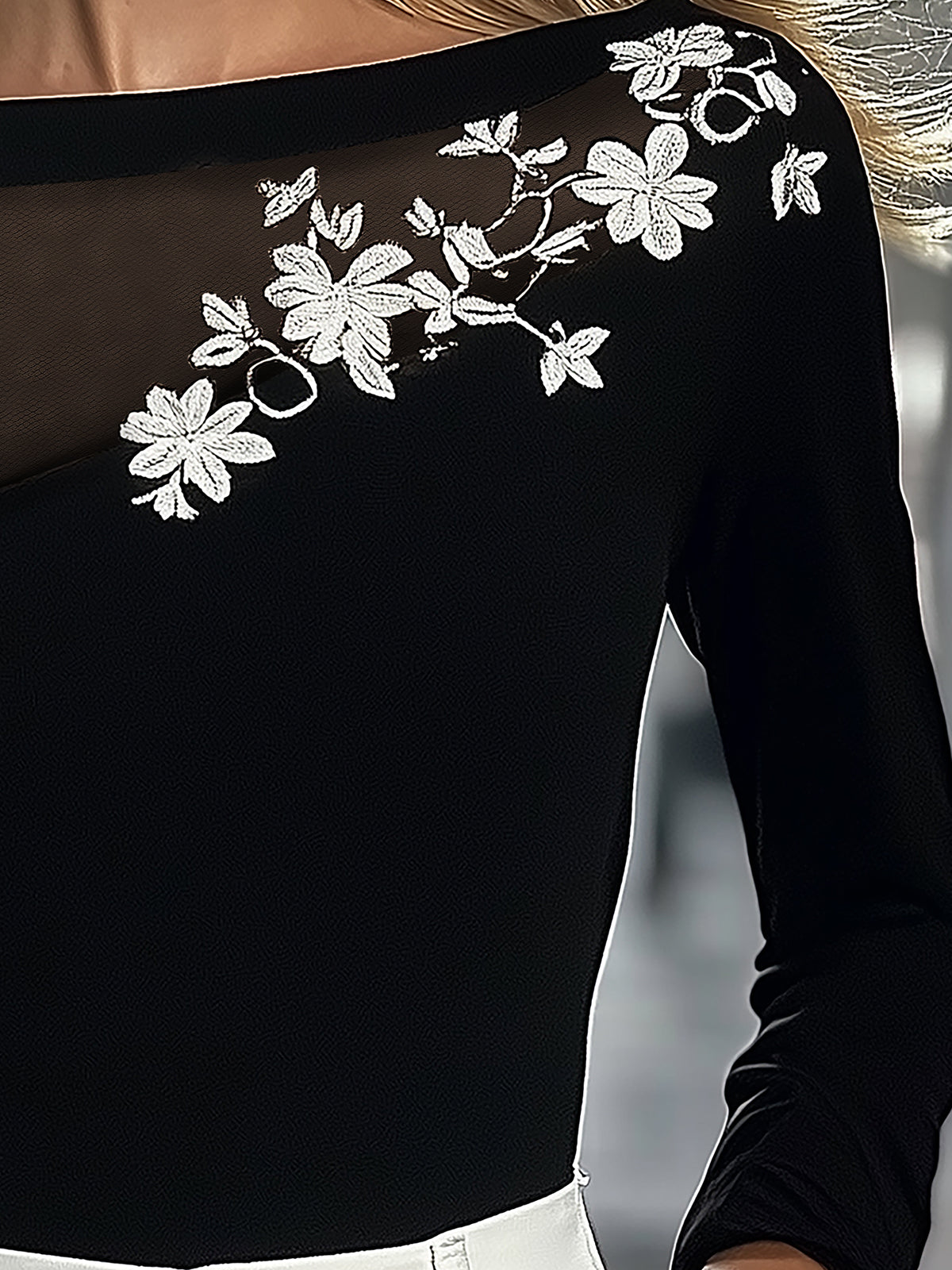 Black Top With Mesh Neckline And Floral Embroidery