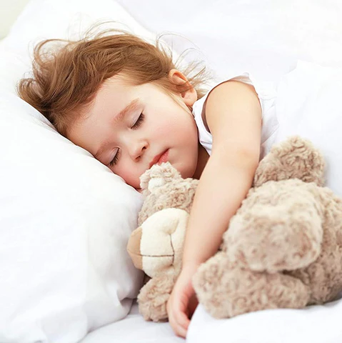 Toddler sleeping on a contoured kids pillow