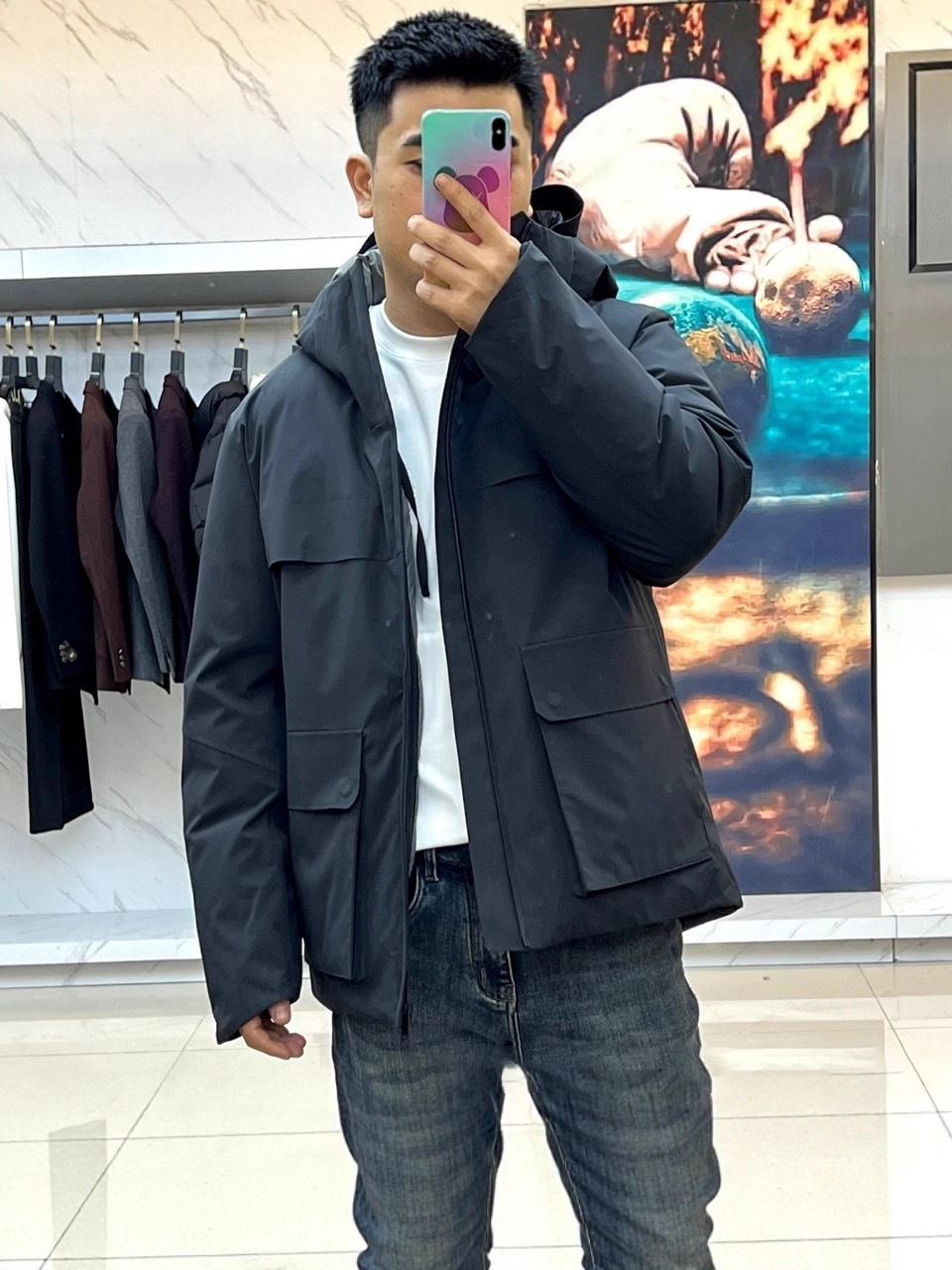 Three-in-one detachable jacket with down lining, windproof and waterproof.