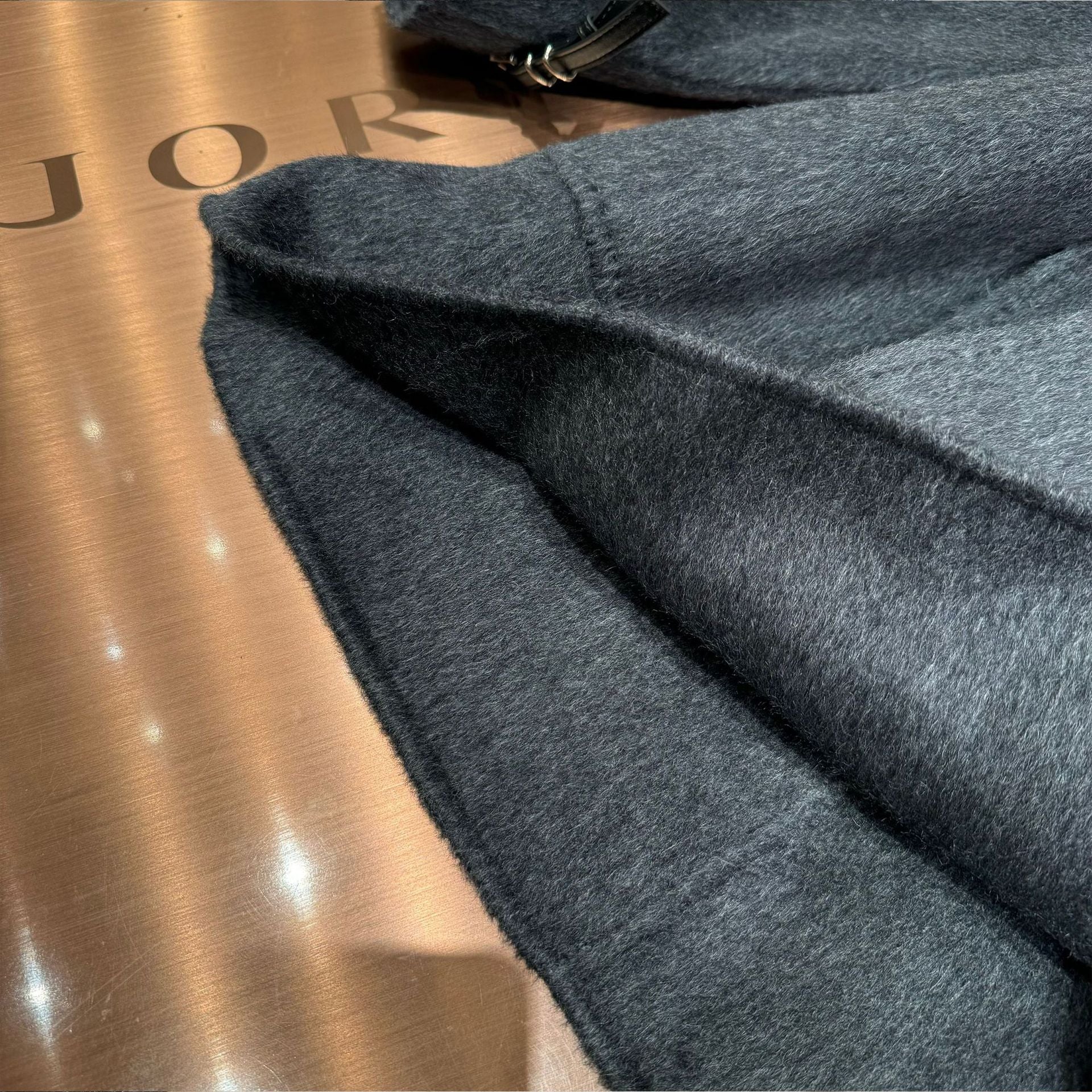 Gray long-sleeved trench coat with a belt design