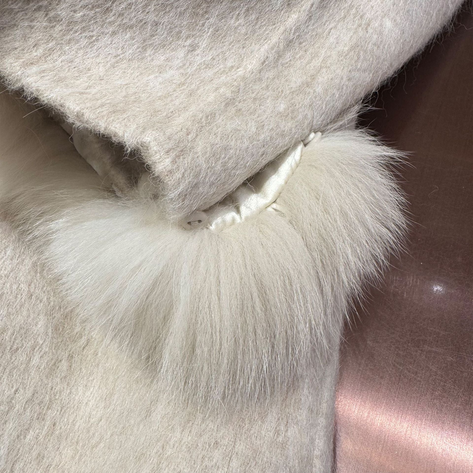 White coat with fur-trimmed sleeves, belted collar, and warm double-faced wool fabric