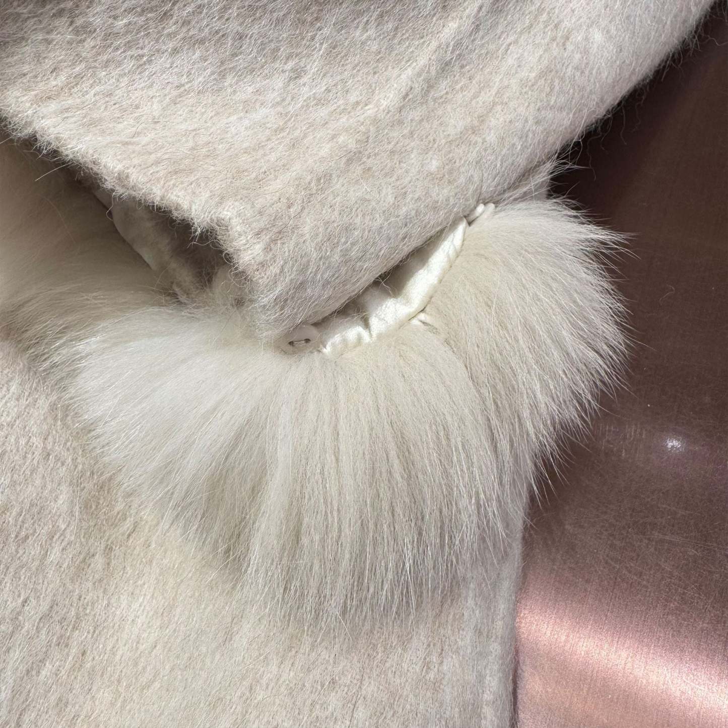 White coat with fur-trimmed sleeves, belted collar, and warm double-faced wool fabric