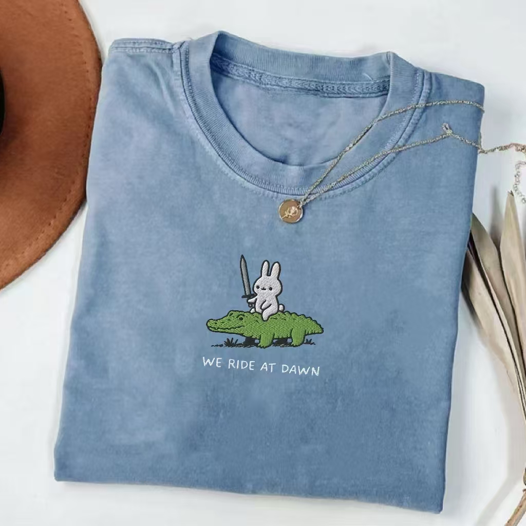 We Ride At Dawn" Bunny Warrior Graphic T-Shirt