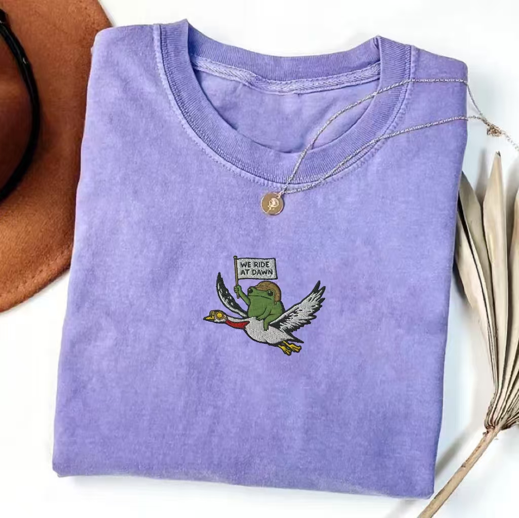 "We Ride At Dawn" Frog & Duck Embroidered T-shirt