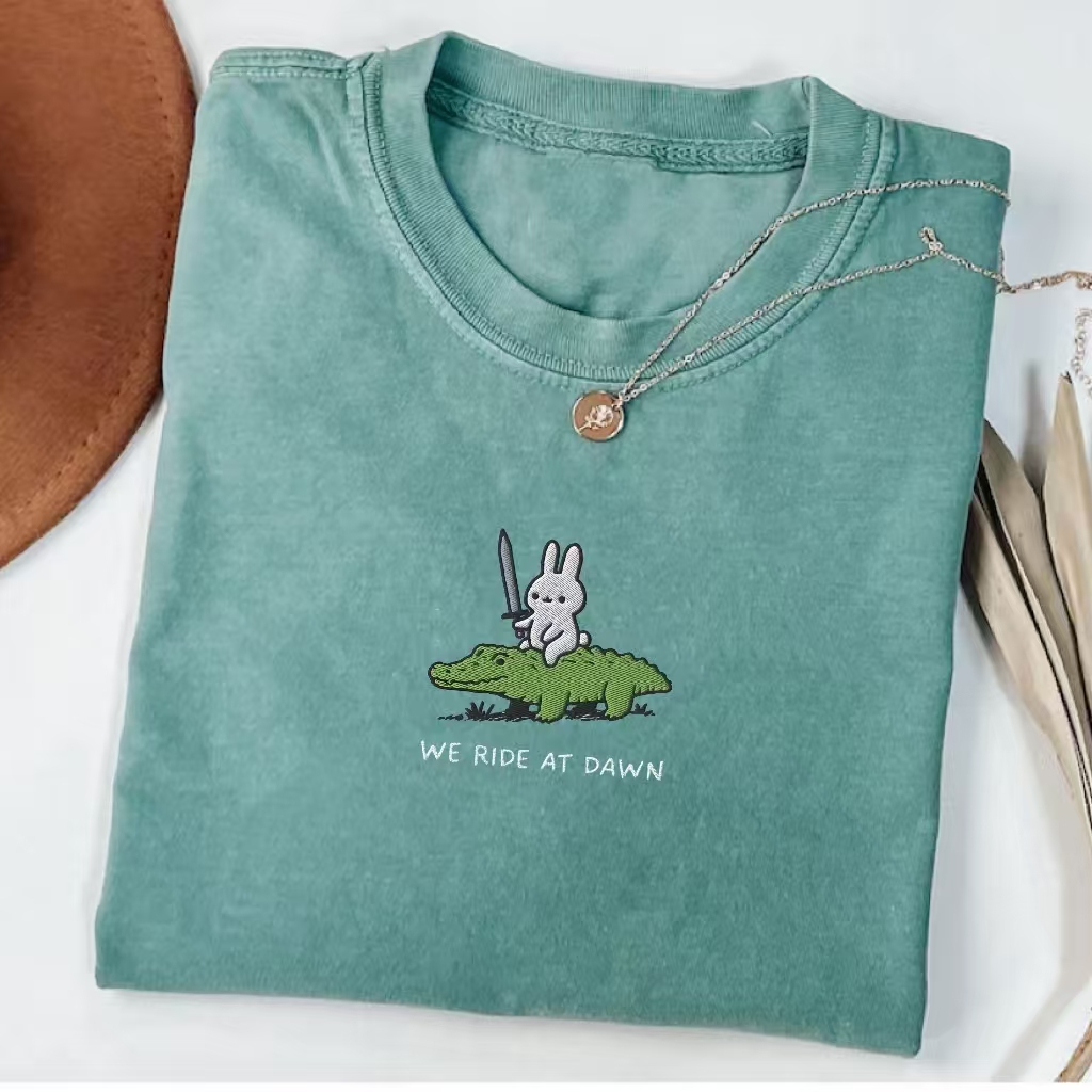 We Ride At Dawn" Bunny Warrior Graphic T-Shirt