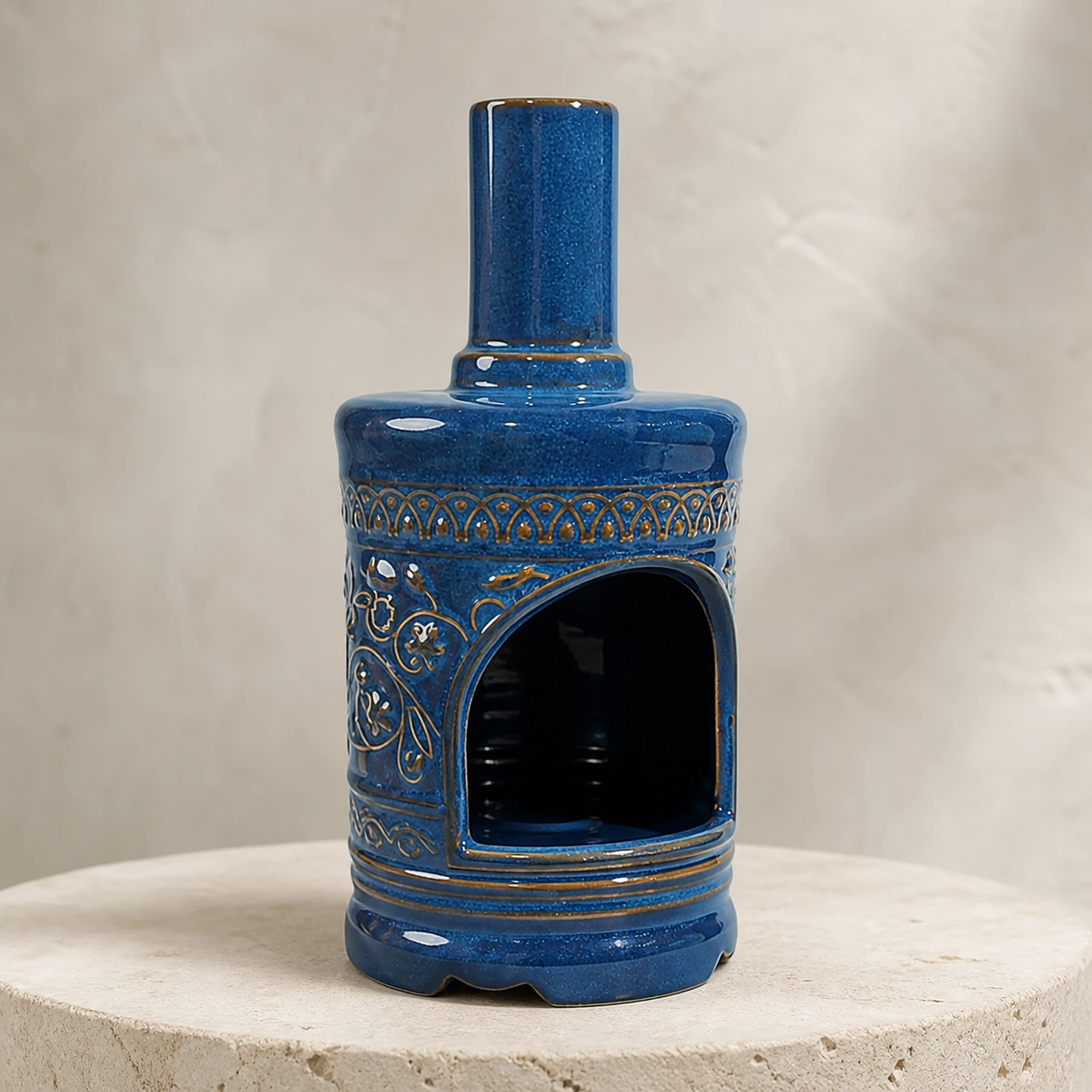 Blue ceramic Palo Santo holder empty in a clean front product view