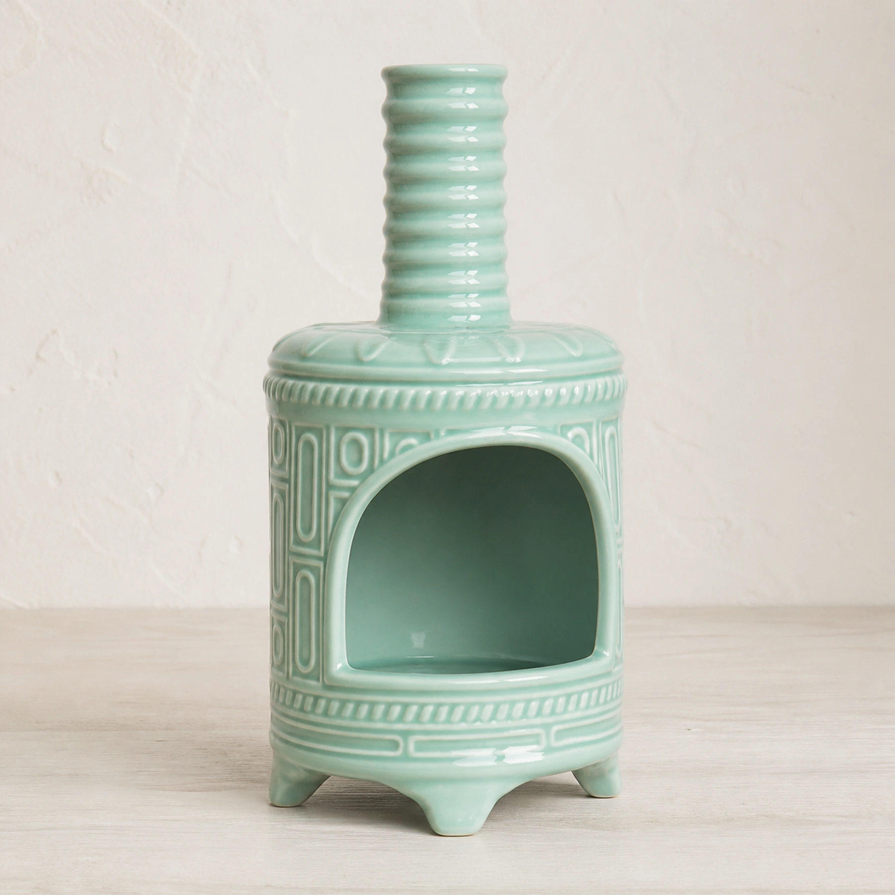 Light Green ceramic Palo Santo holder empty in a clean front product view