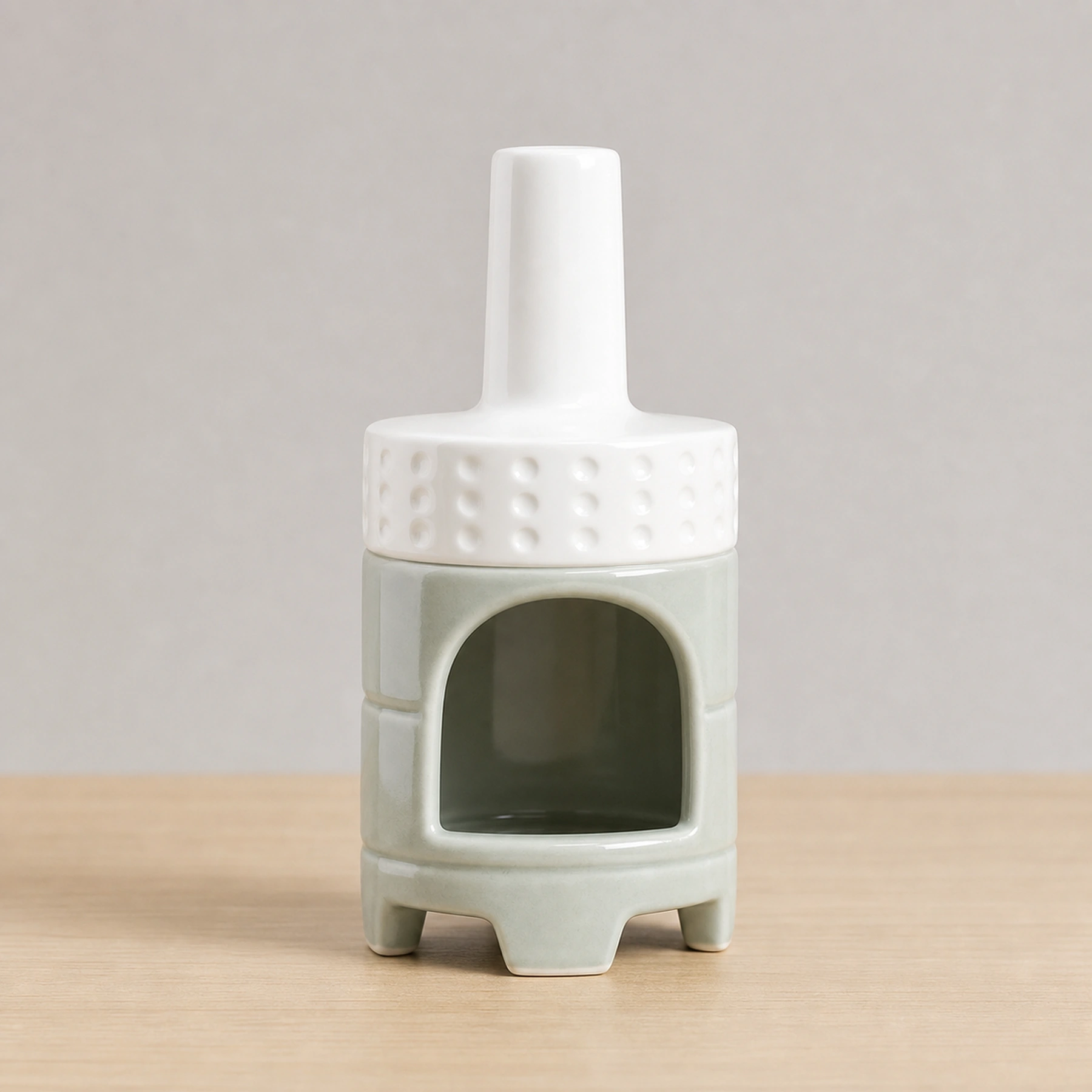 White Green ceramic Palo Santo holder empty in a clean front product view