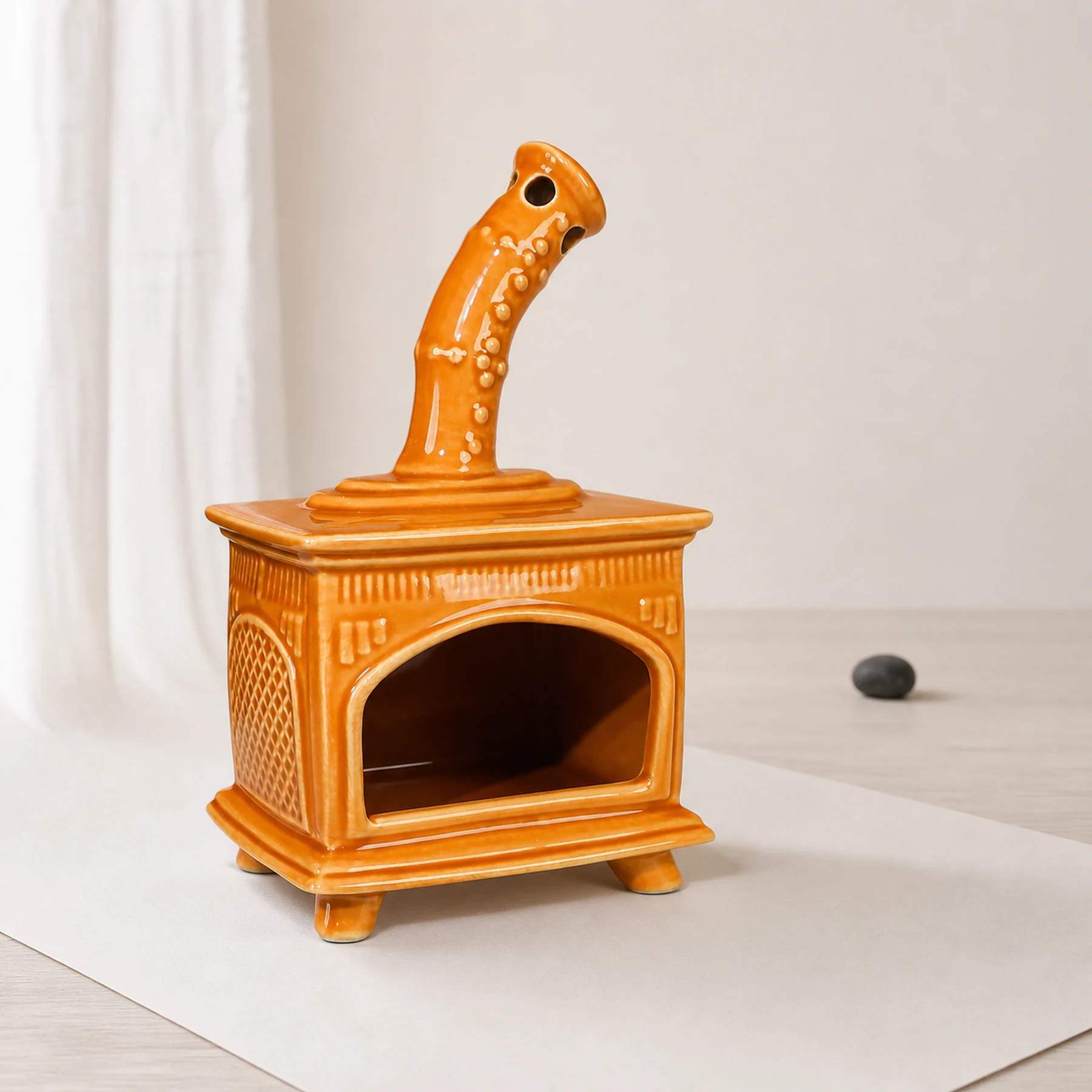 Orange ceramic fireplace incense holder clean three-quarter view