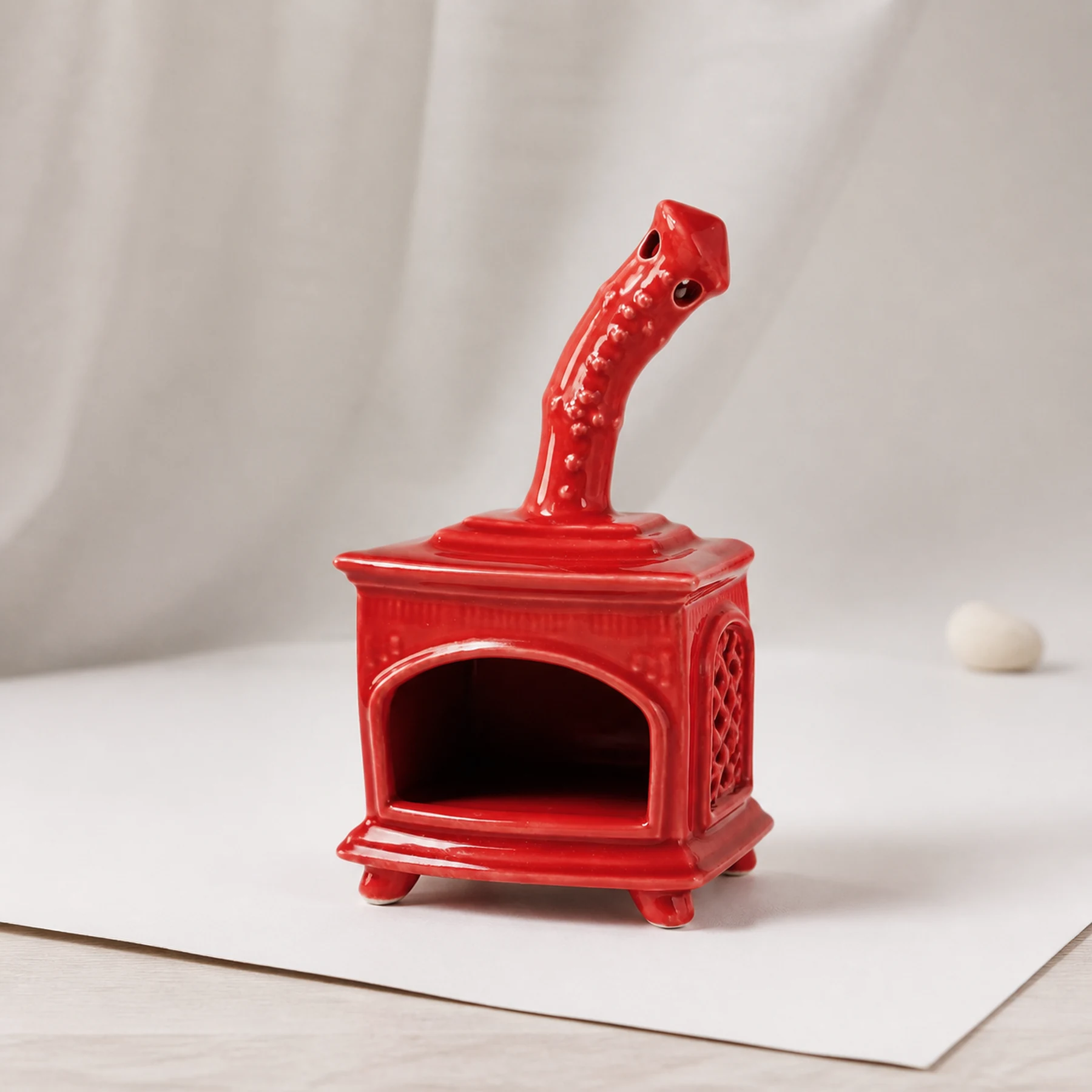 Red ceramic fireplace incense holder clean three-quarter view