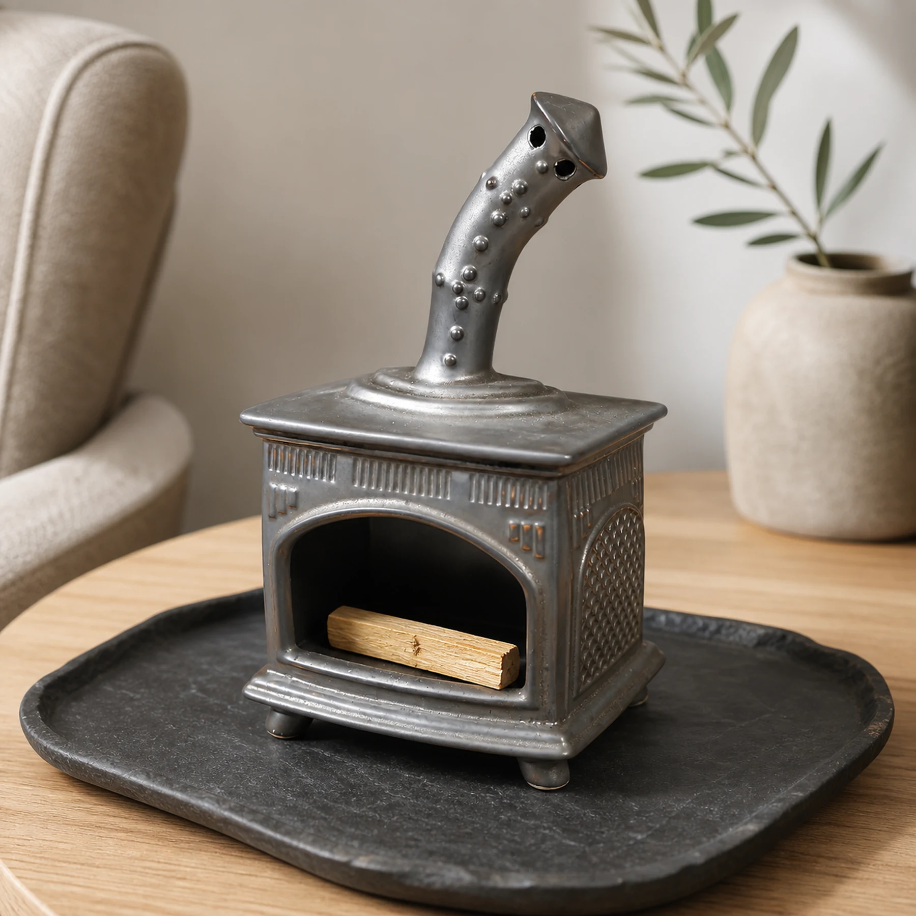 Copper Gray ceramic fireplace incense holder with unlit Palo Santo placed in the open hearth