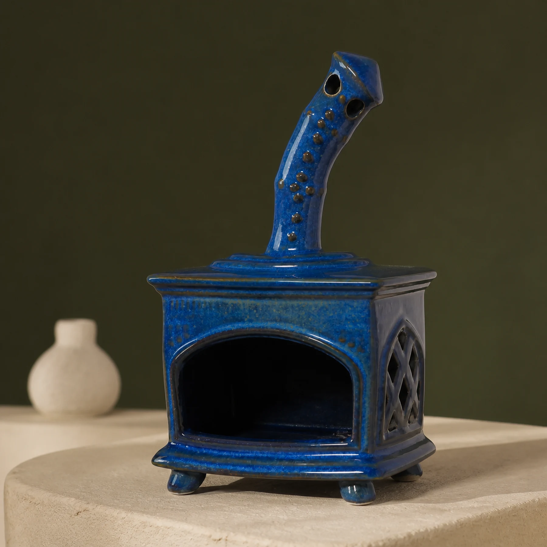 Blue ceramic fireplace incense holder curved chimney and glaze detail