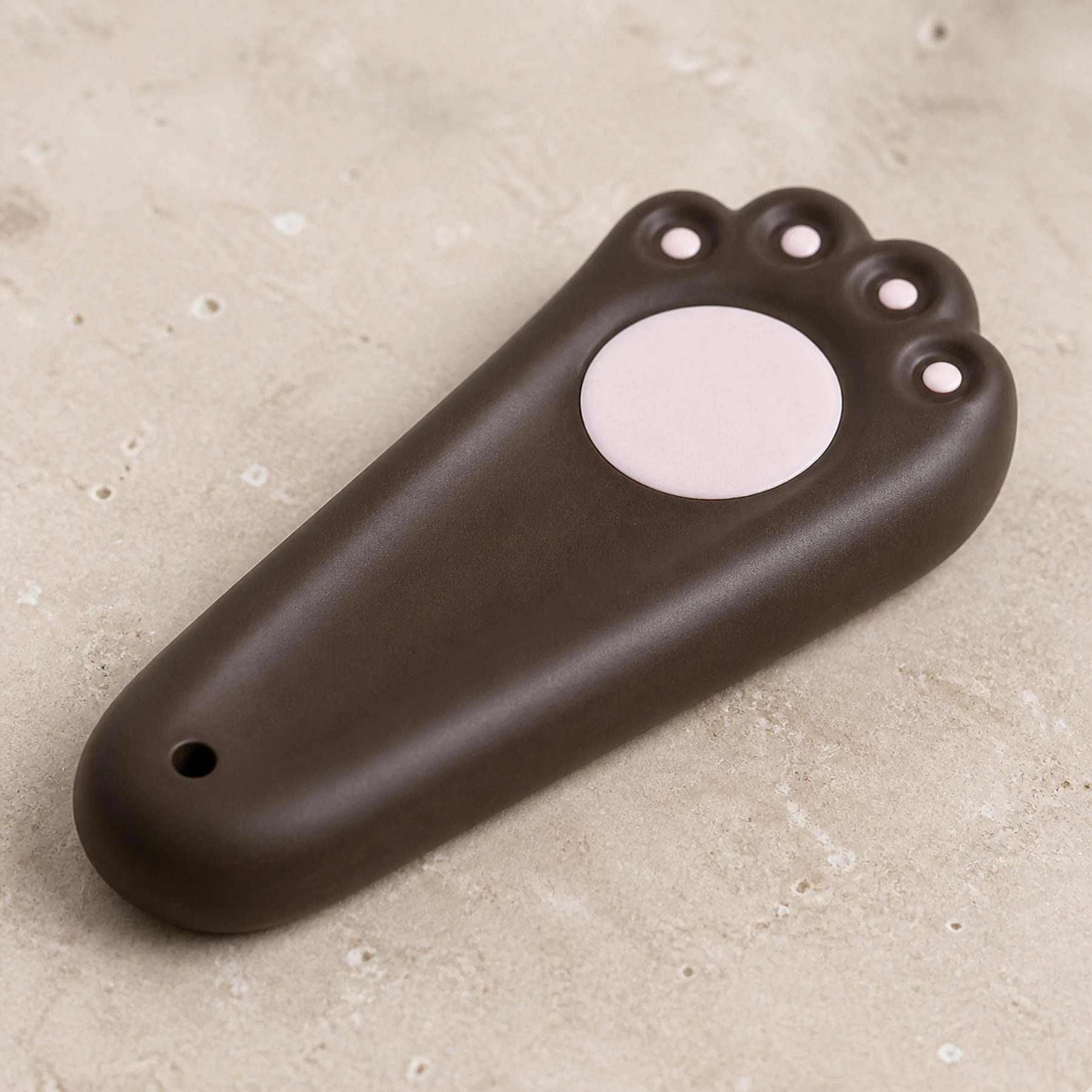 Dark brown cat paw incense holder ceramic and pink pad detail
