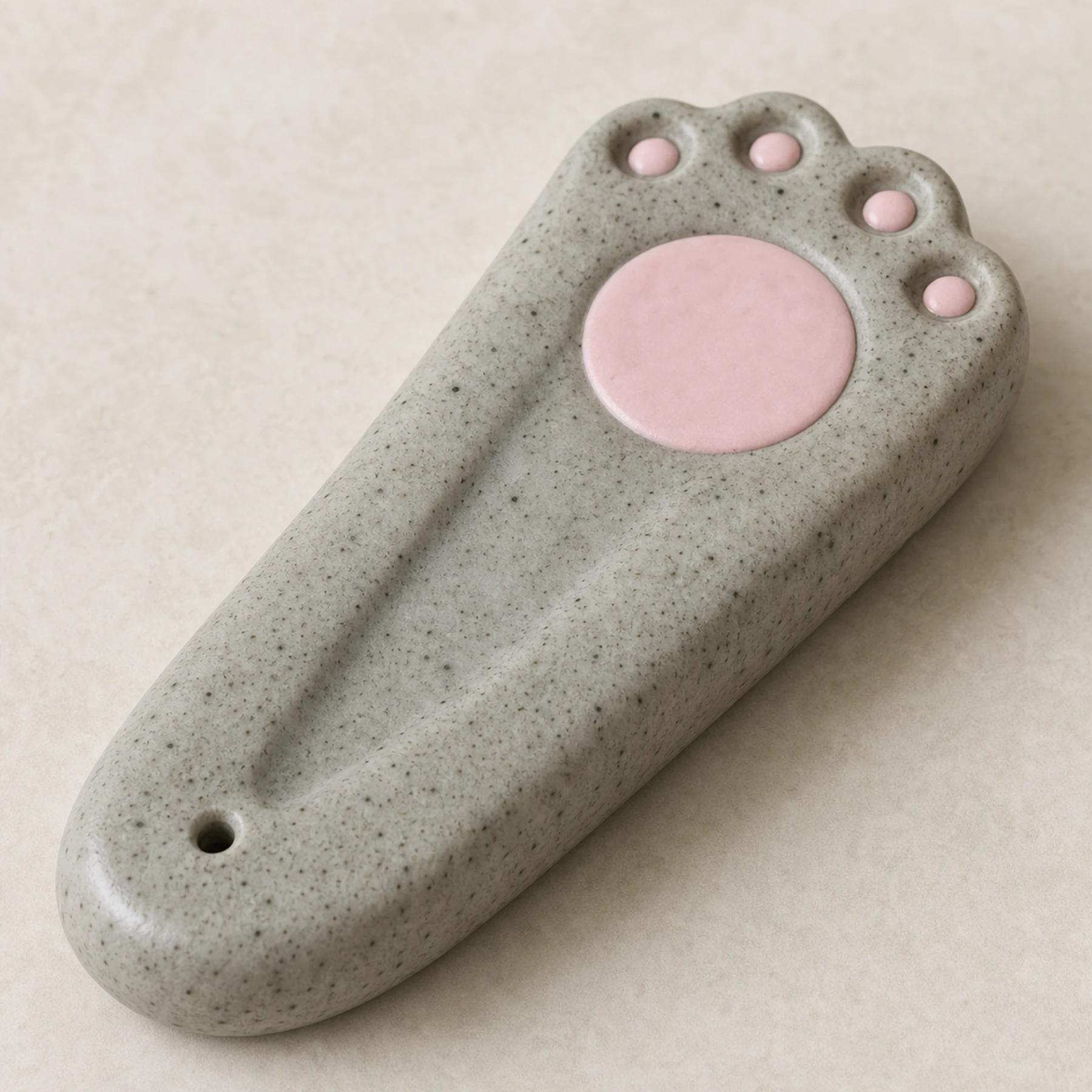 Speckled gray cat paw incense holder ceramic and pink pad detail