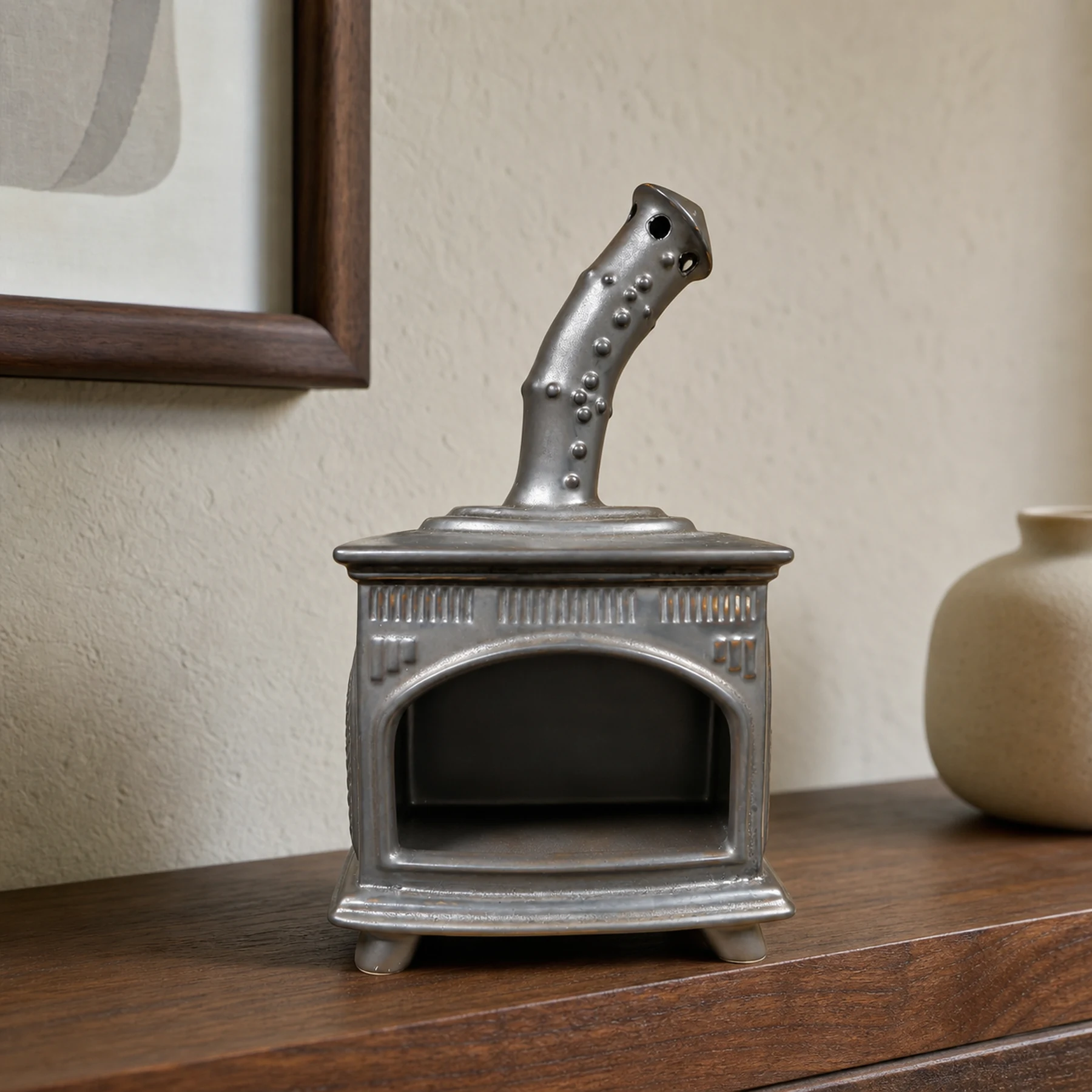 Copper Gray ceramic fireplace incense holder styled on a home mantel shelf