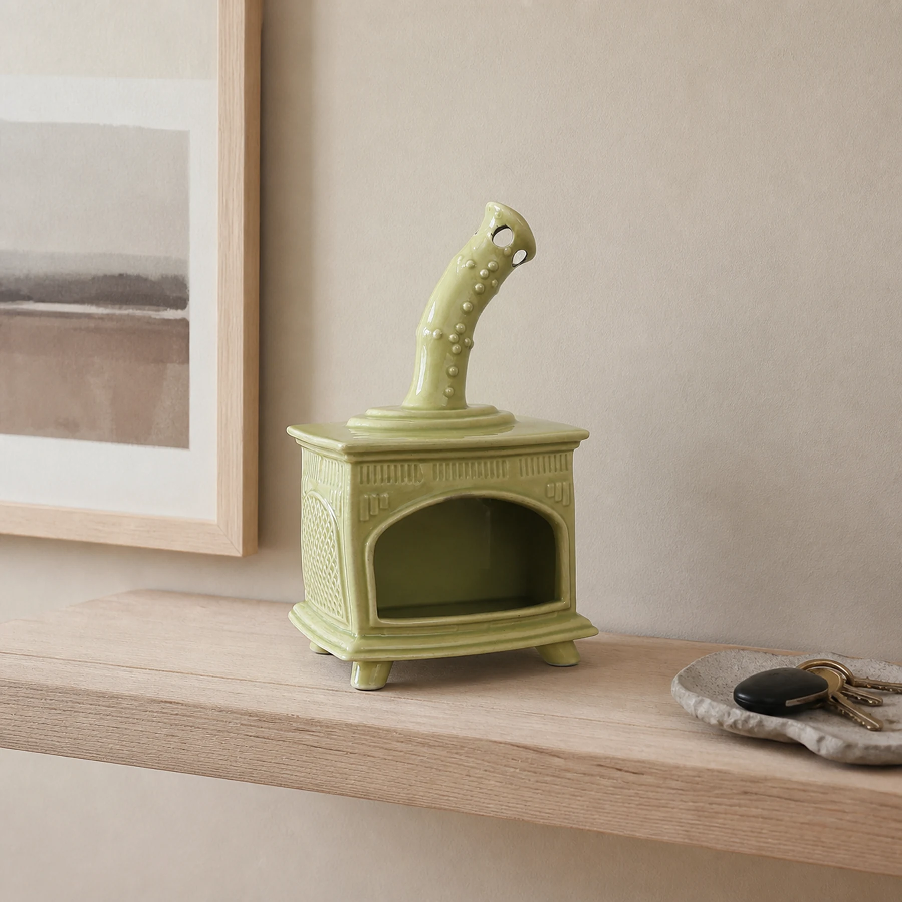 Light Green ceramic fireplace incense holder styled on a home mantel shelf