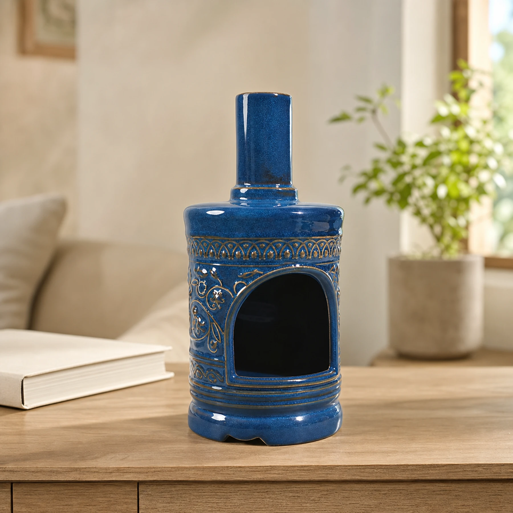 Blue ceramic incense burner displayed empty in an ordinary home setting