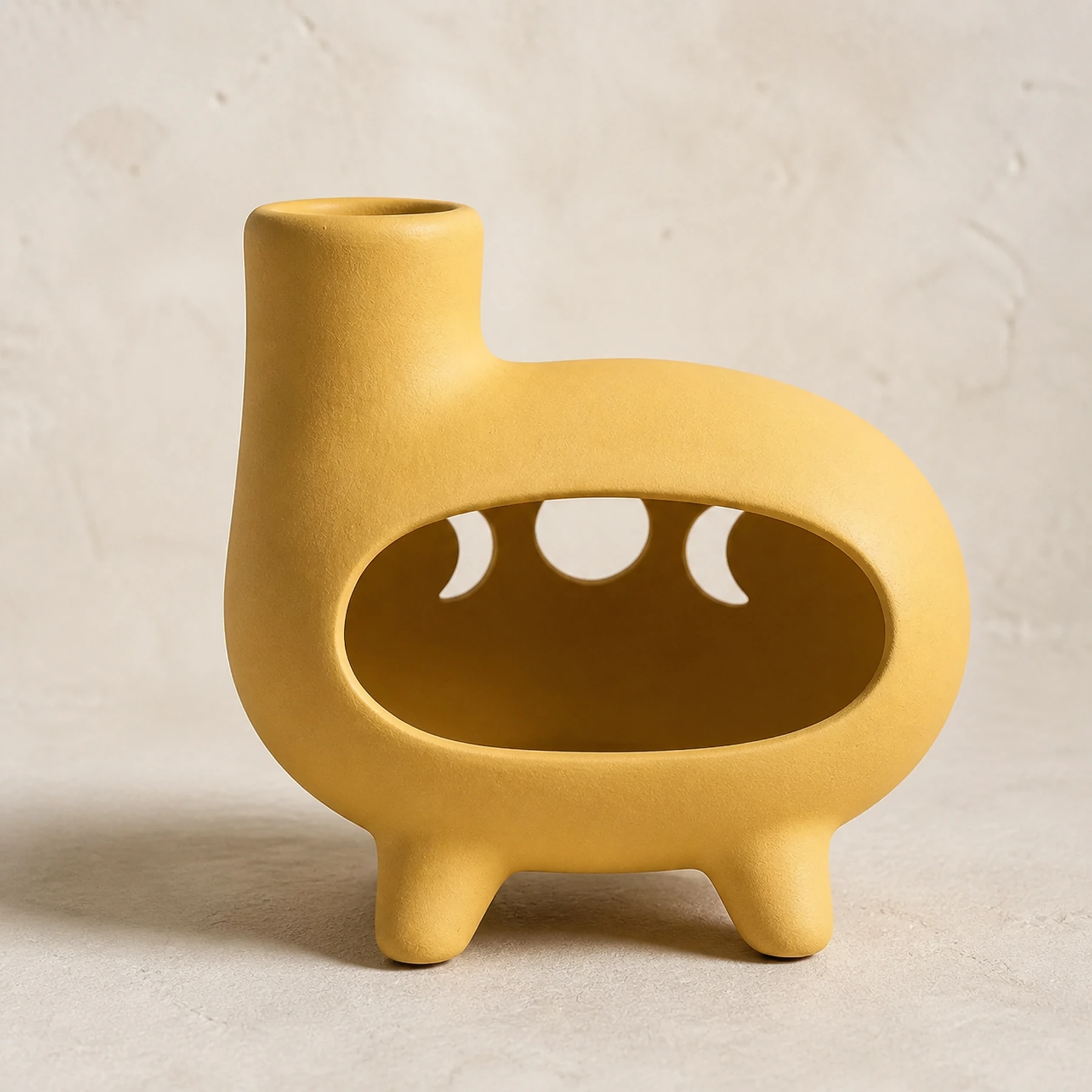 Matte yellow ceramic Palo Santo holder structure study showing chimney, firebox, and tripod feet