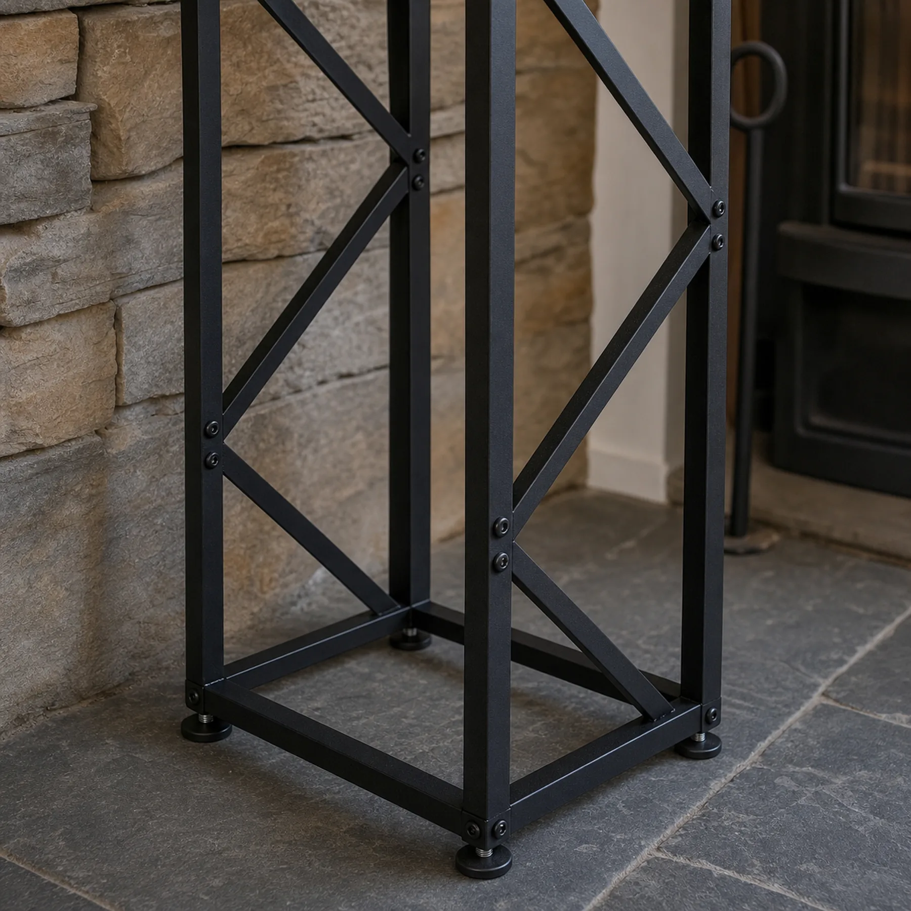 Tall Black Metal Firewood Rack with Adjustable Feet - adjustable feet and bolt detail