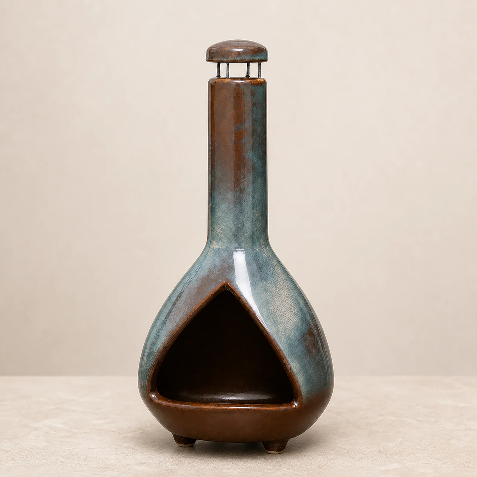 Army Green grey-green and brown ceramic Palo Santo holder shown empty from the front on a warm neutral surface