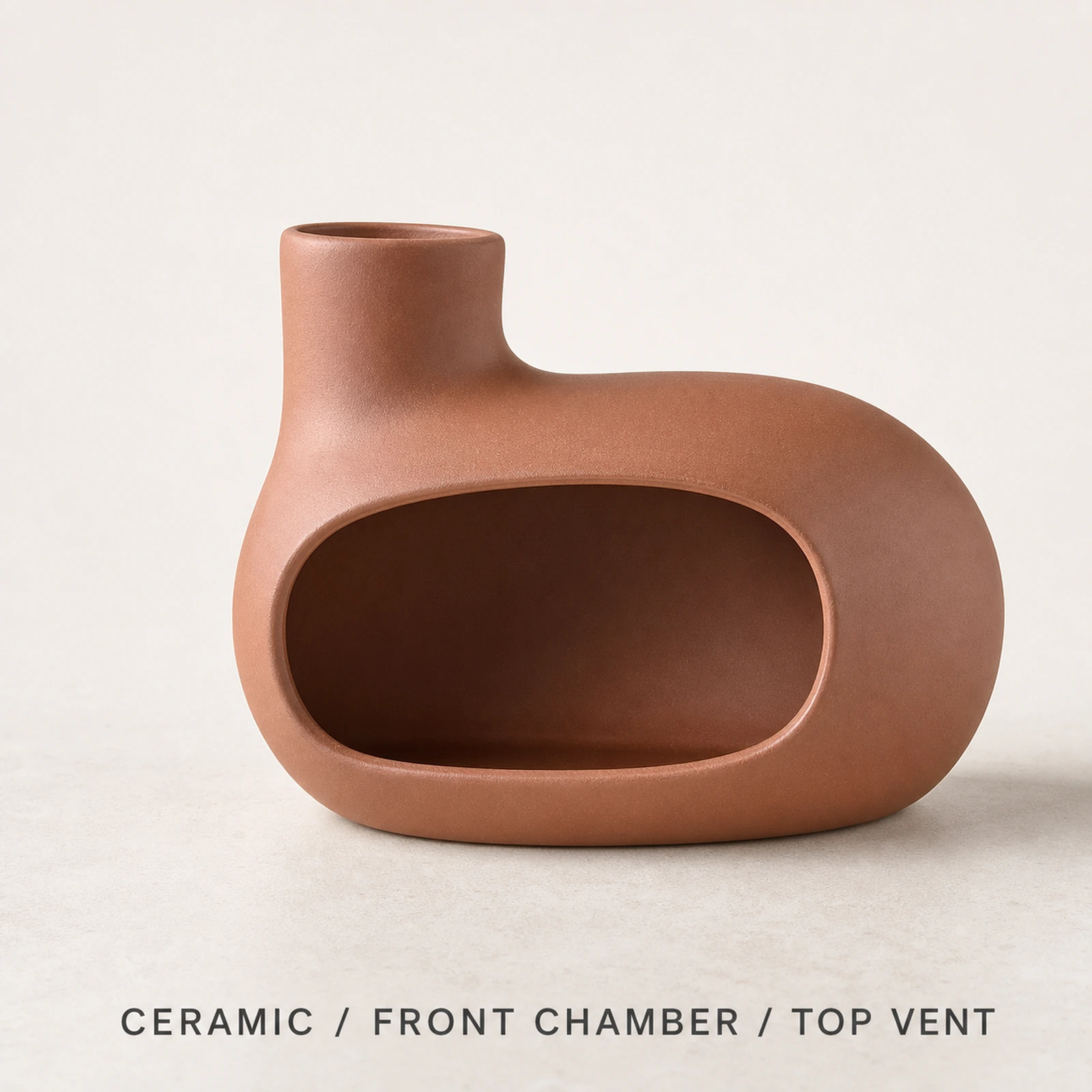 Auburn red Classic Ceramic Palo Santo & Sage Burner, fact view identifying the ceramic body, front chamber, and top vent.