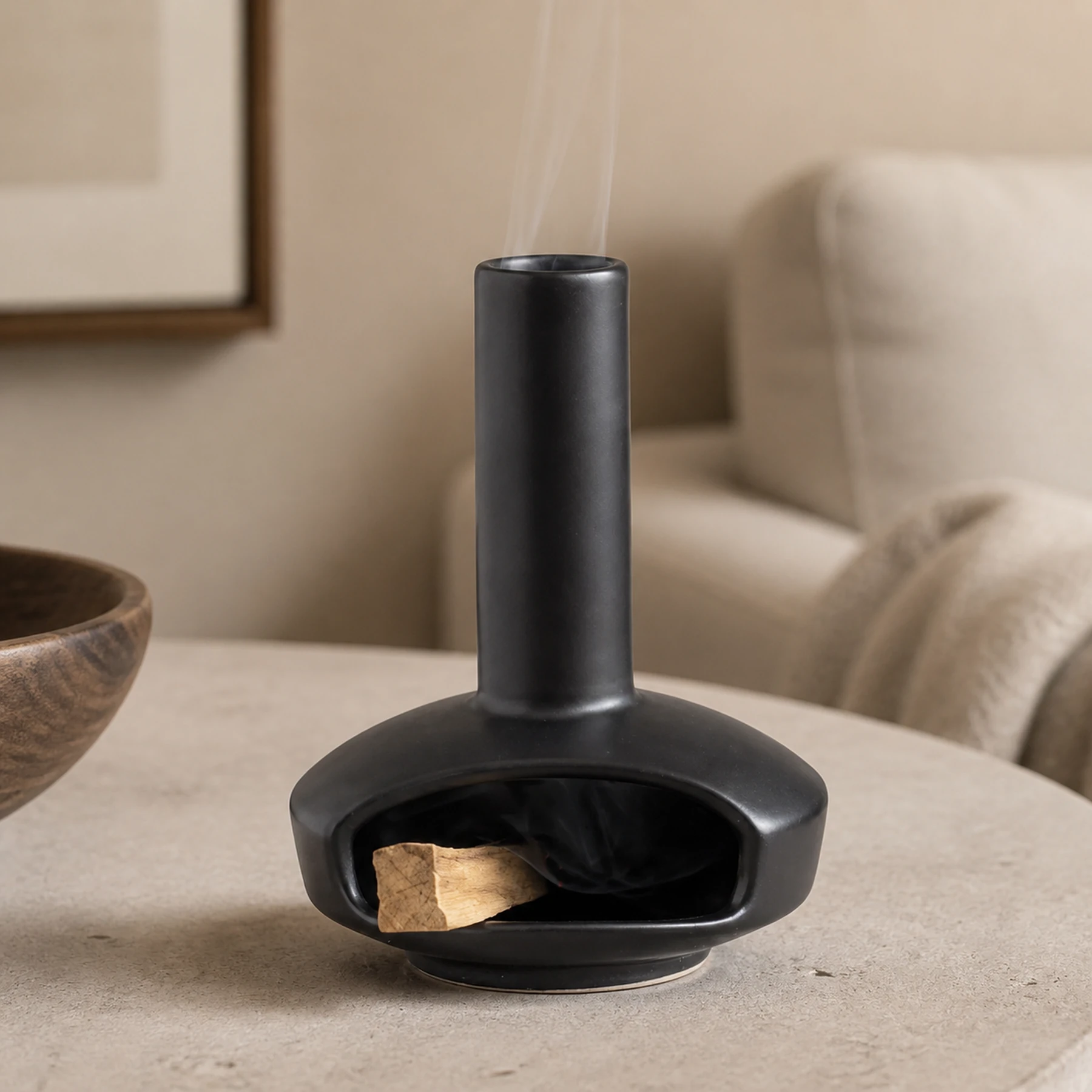 Black mini ceramic Palo Santo burner with short wood and chimney smoke