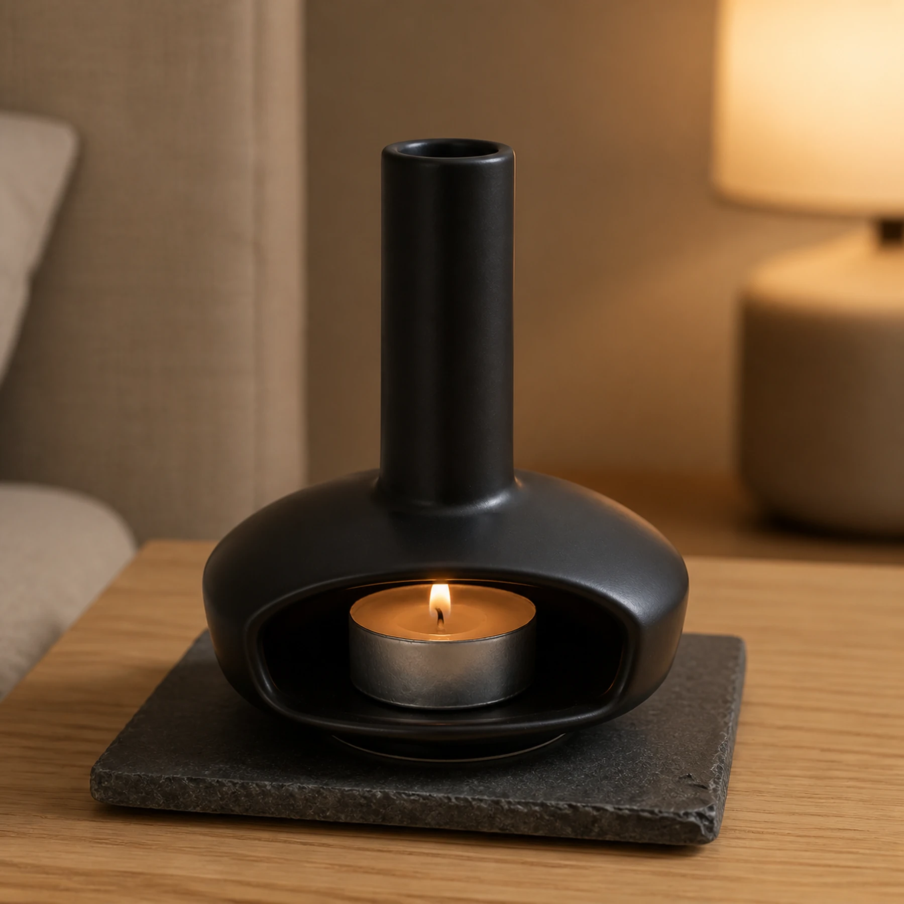 Black mini ceramic hearth with fitted lit tealight