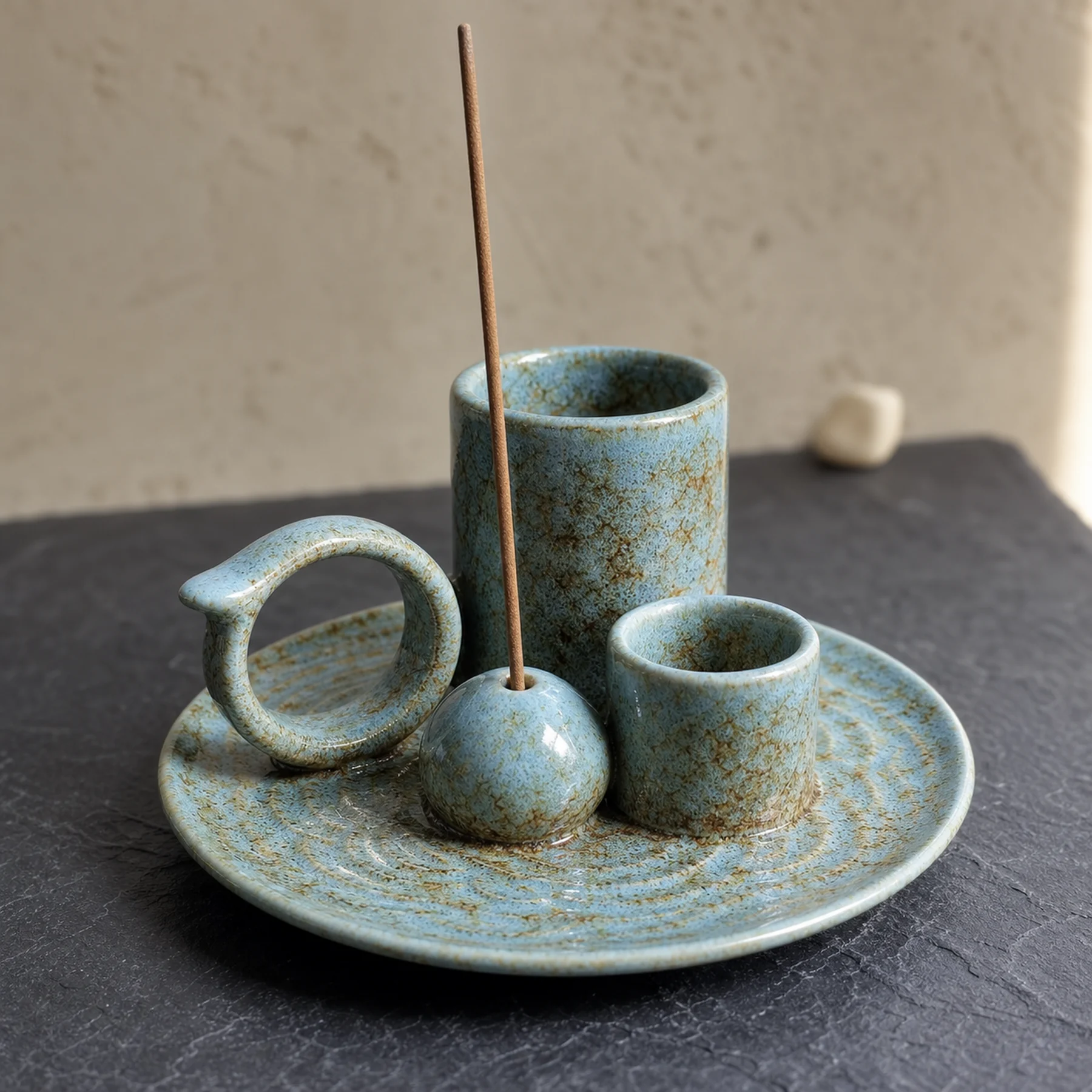 Blue glaze 5-in-1 ceramic smudge bowl close-up showing embossed tray, glaze, cups, ring, and incense-stick seat