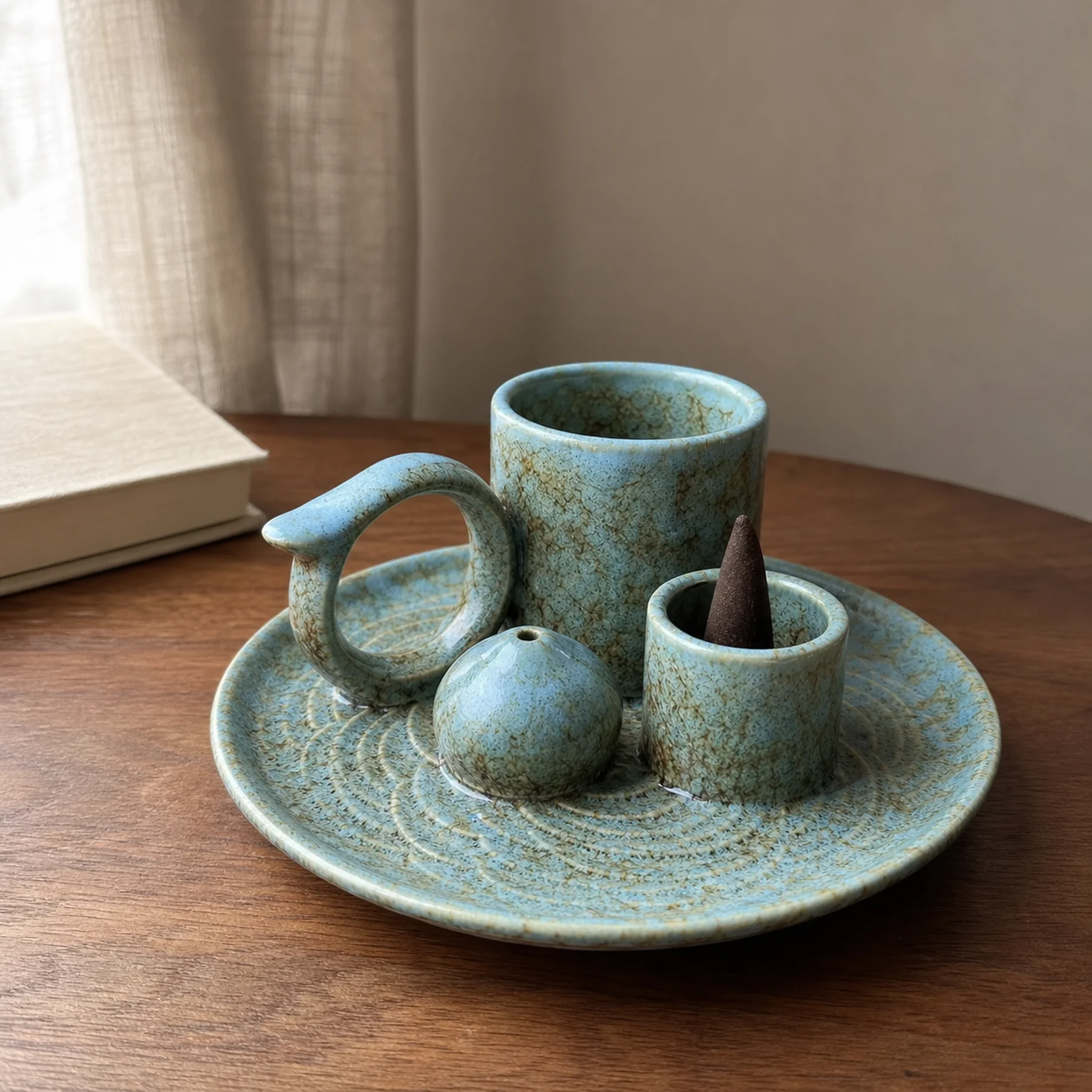 Blue glaze 5-in-1 ceramic smudge bowl styled with a deep cocoa-brown tapered incense cone