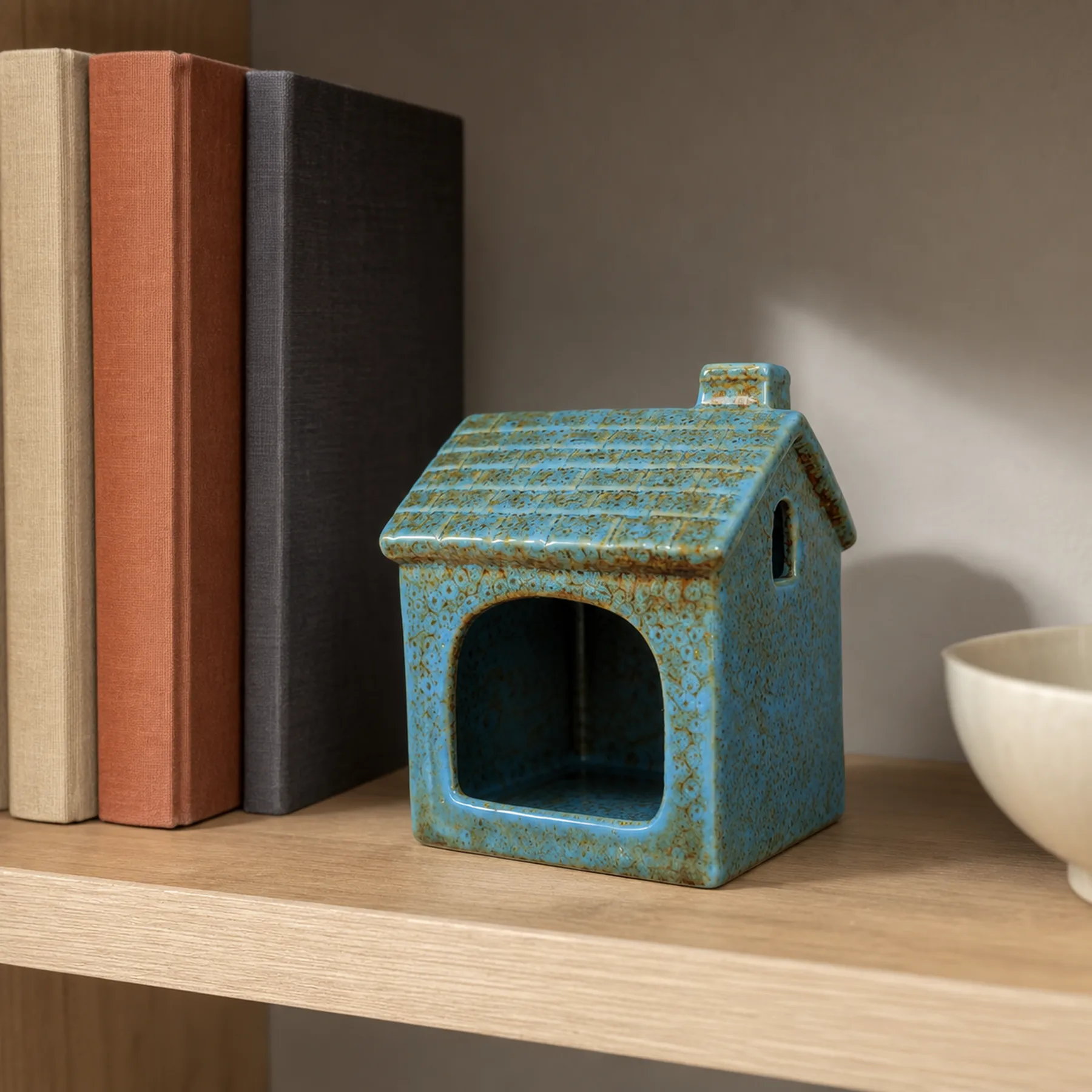 Blue ceramic house Palo Santo holder in an American home
