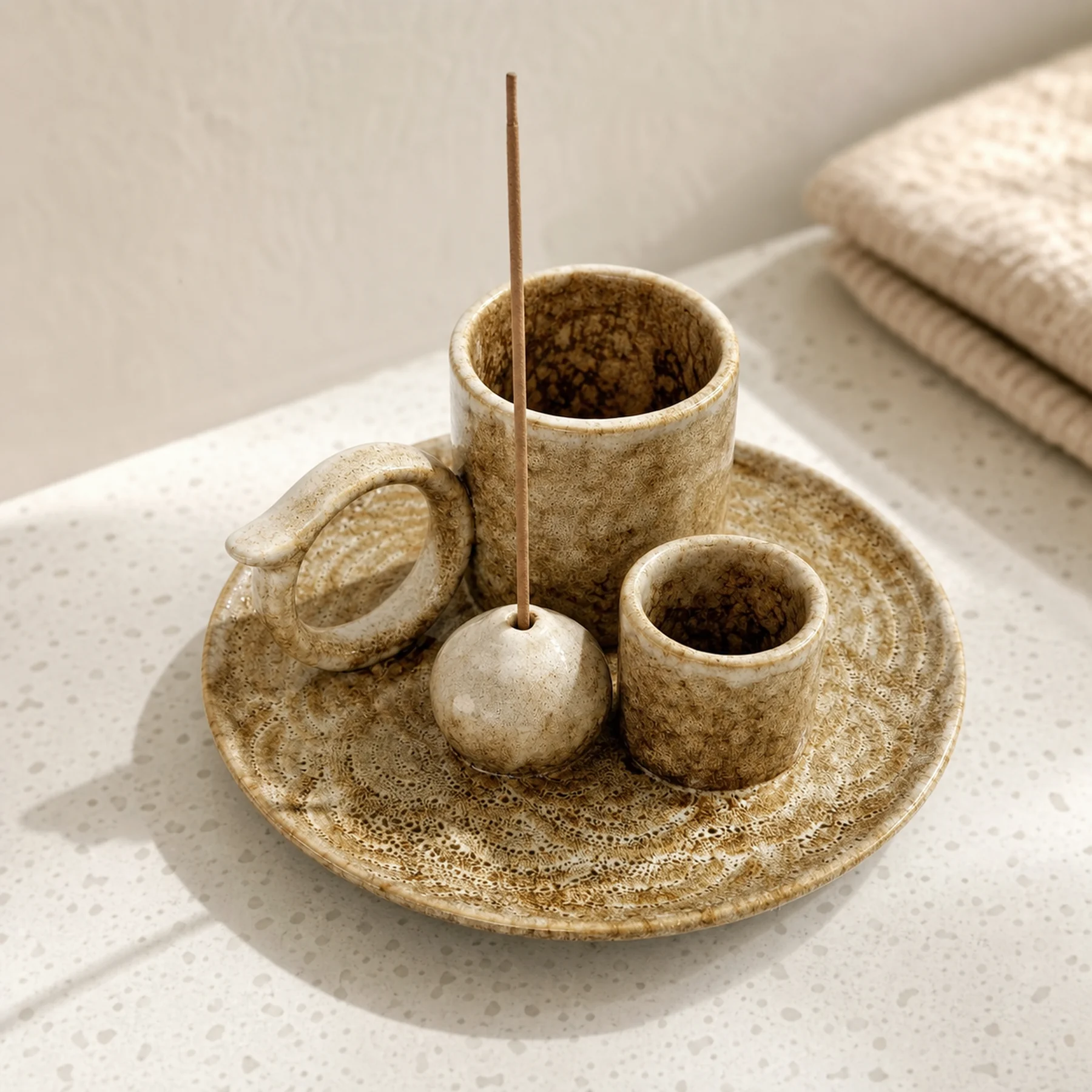 Brown glaze 5-in-1 ceramic smudge bowl close-up showing embossed tray, glaze, cups, ring, and incense-stick seat