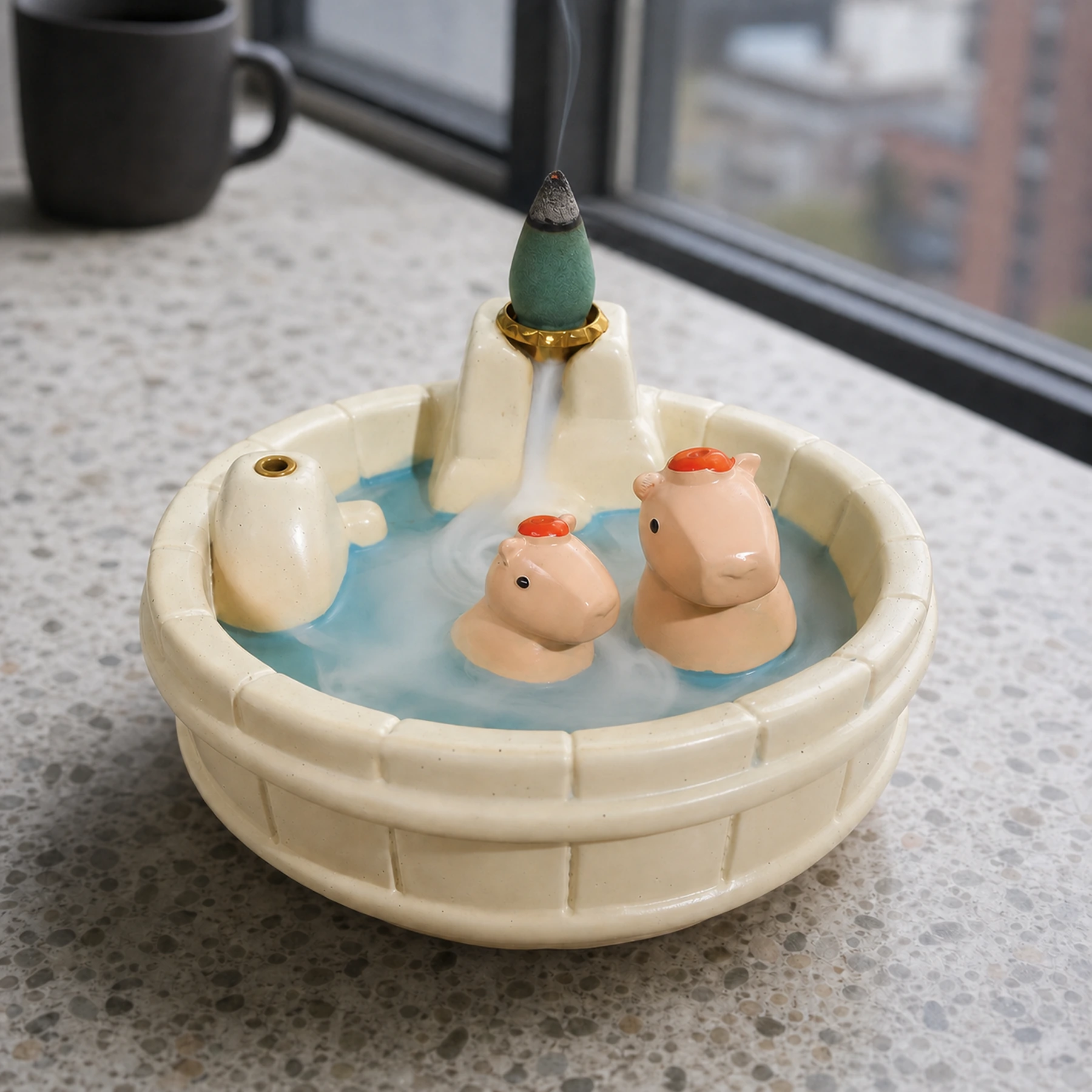 White resin capybara incense burner showing a smoldering backflow cone and descending waterfall smoke path