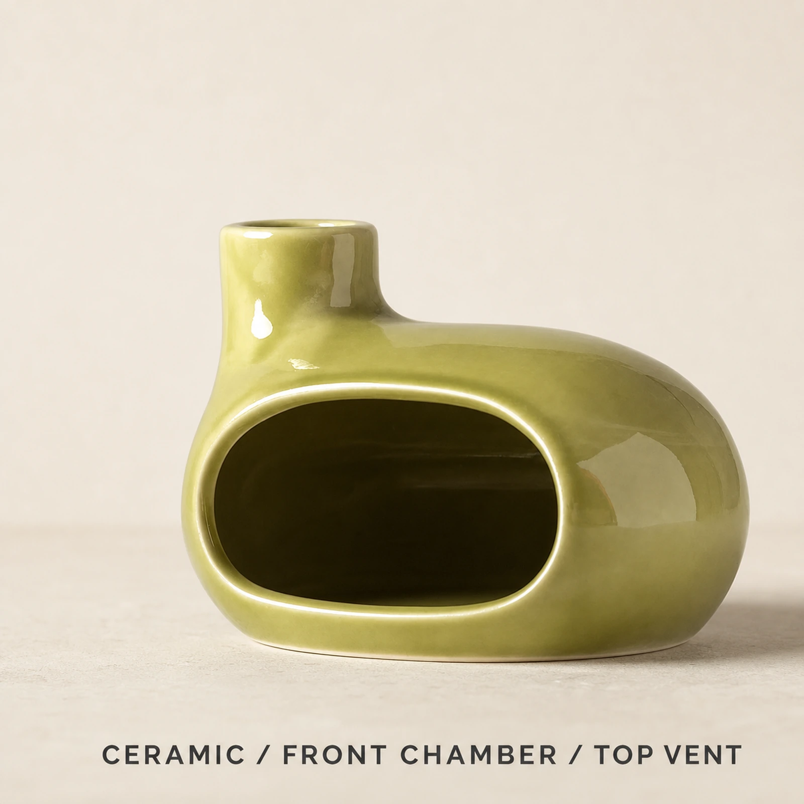 Emerald green Classic Ceramic Palo Santo & Sage Burner, fact view identifying the ceramic body, front chamber, and top vent.