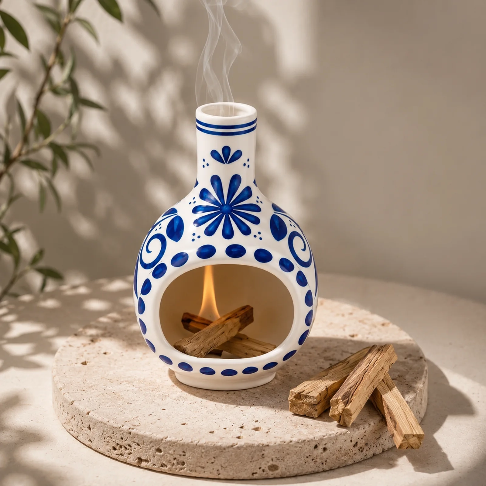 MOUGIGI blue and white ceramic Palo Santo holder in a warm home setting