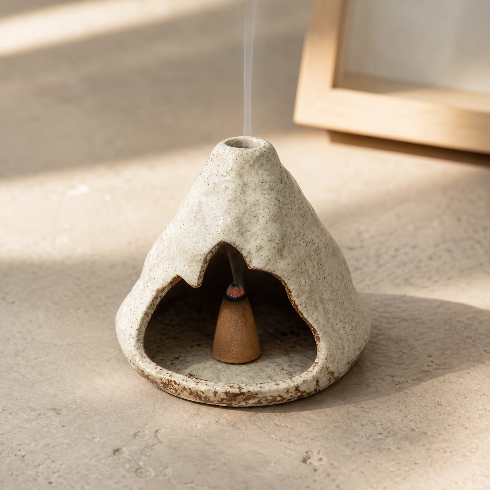 Kiln-Fired Off-White ceramic zongzi incense holder with a tapered incense cone and smoke through the top vent