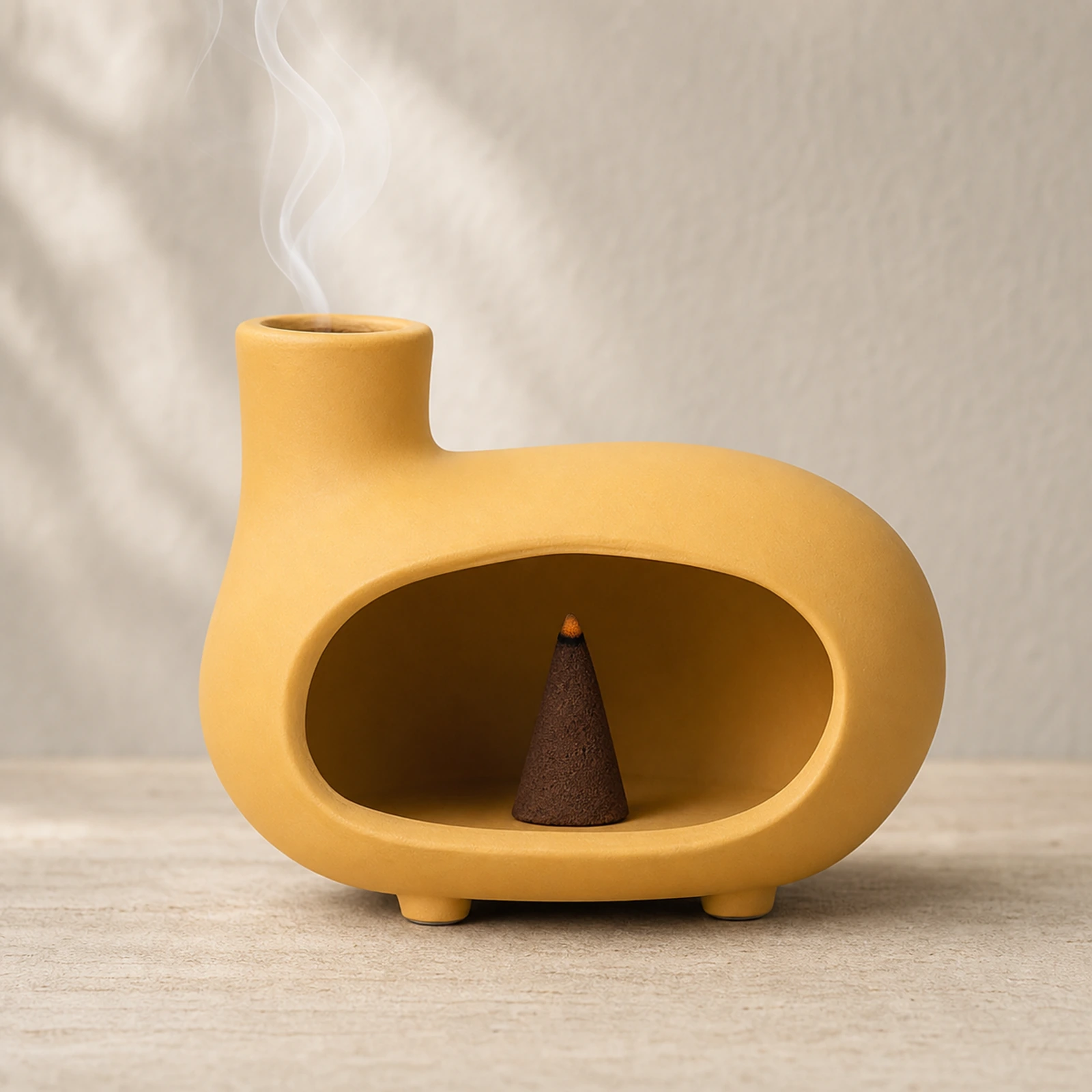 Matte yellow short-foot Classic Ceramic Palo Santo & Sage Burner, using a tapered incense cone with smoke exiting the top vent.