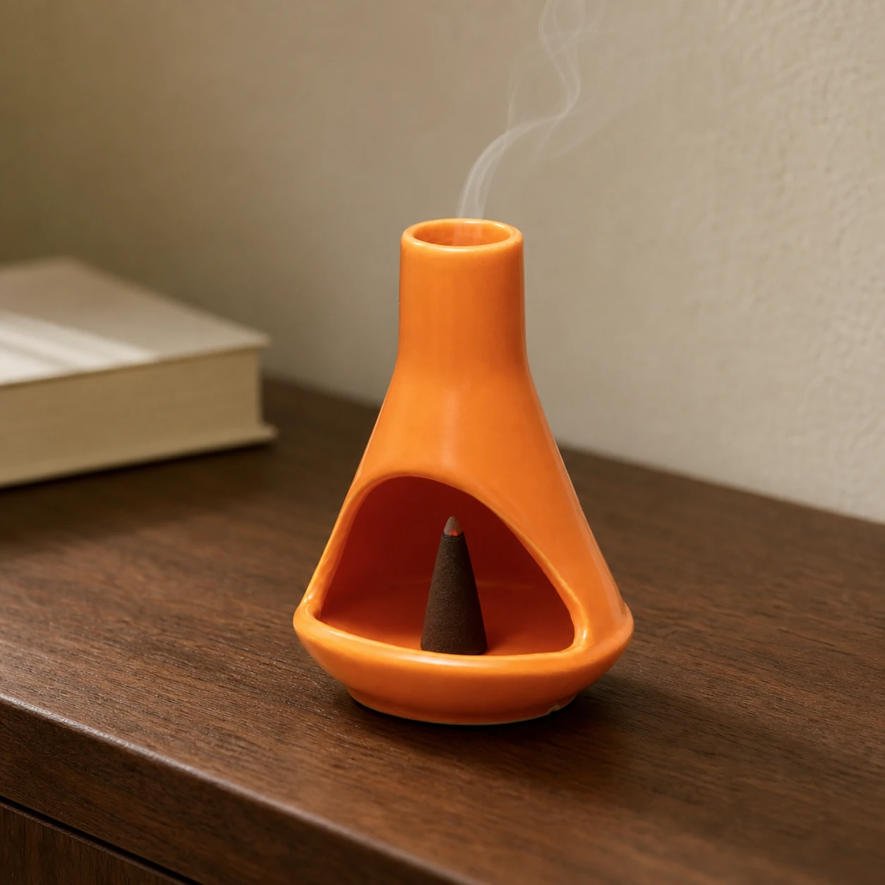 Orange ceramic mini chiminea with tapered incense cone