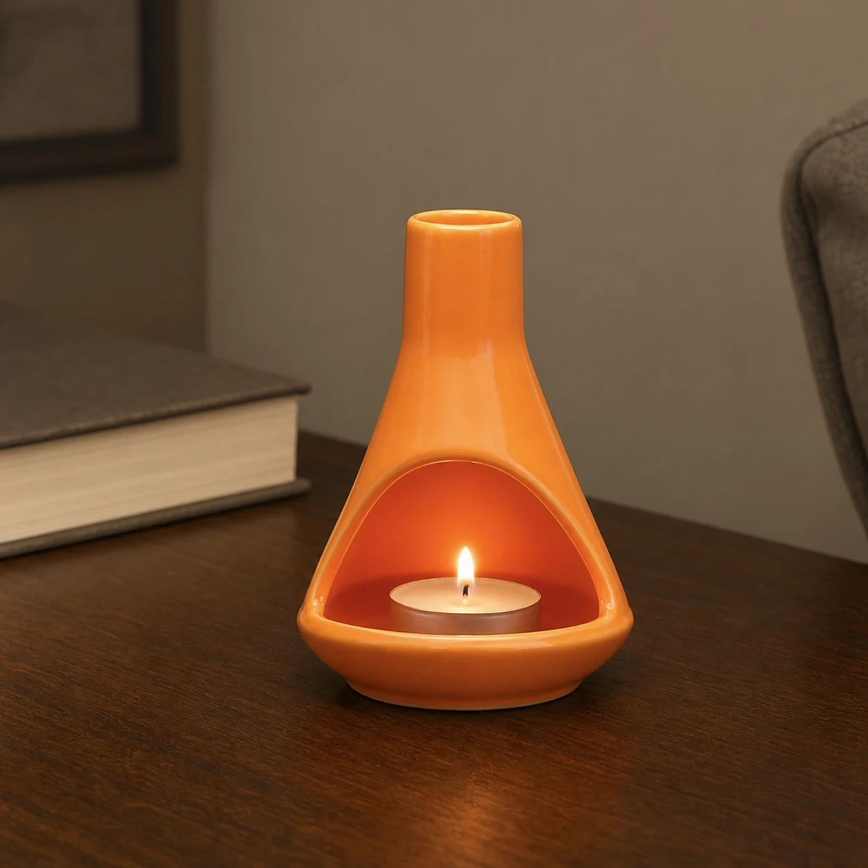 Orange ceramic mini chiminea with small tealight inside hearth
