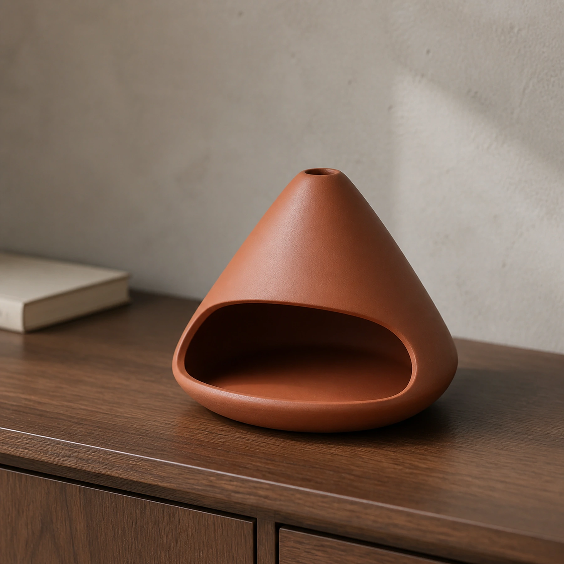 Red ceramic zongzi Palo Santo holder clean product form on a warm neutral surface