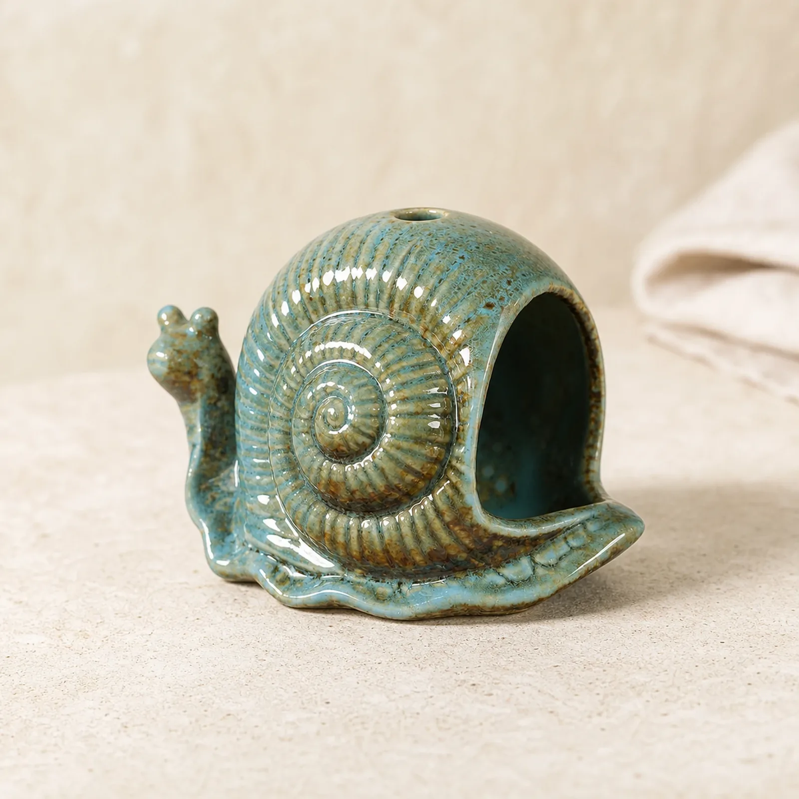 Blue ceramic snail incense burner clean three-quarter product view