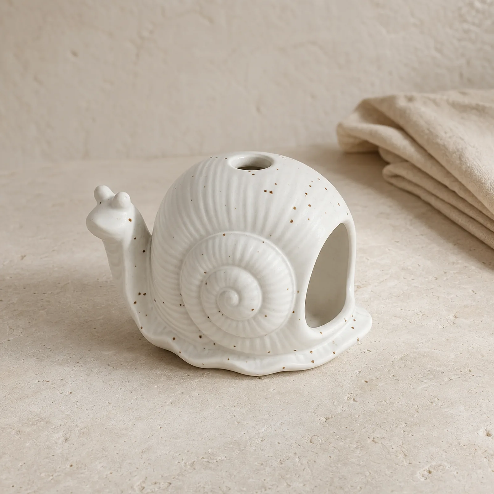 White ceramic snail incense burner clean three-quarter product view